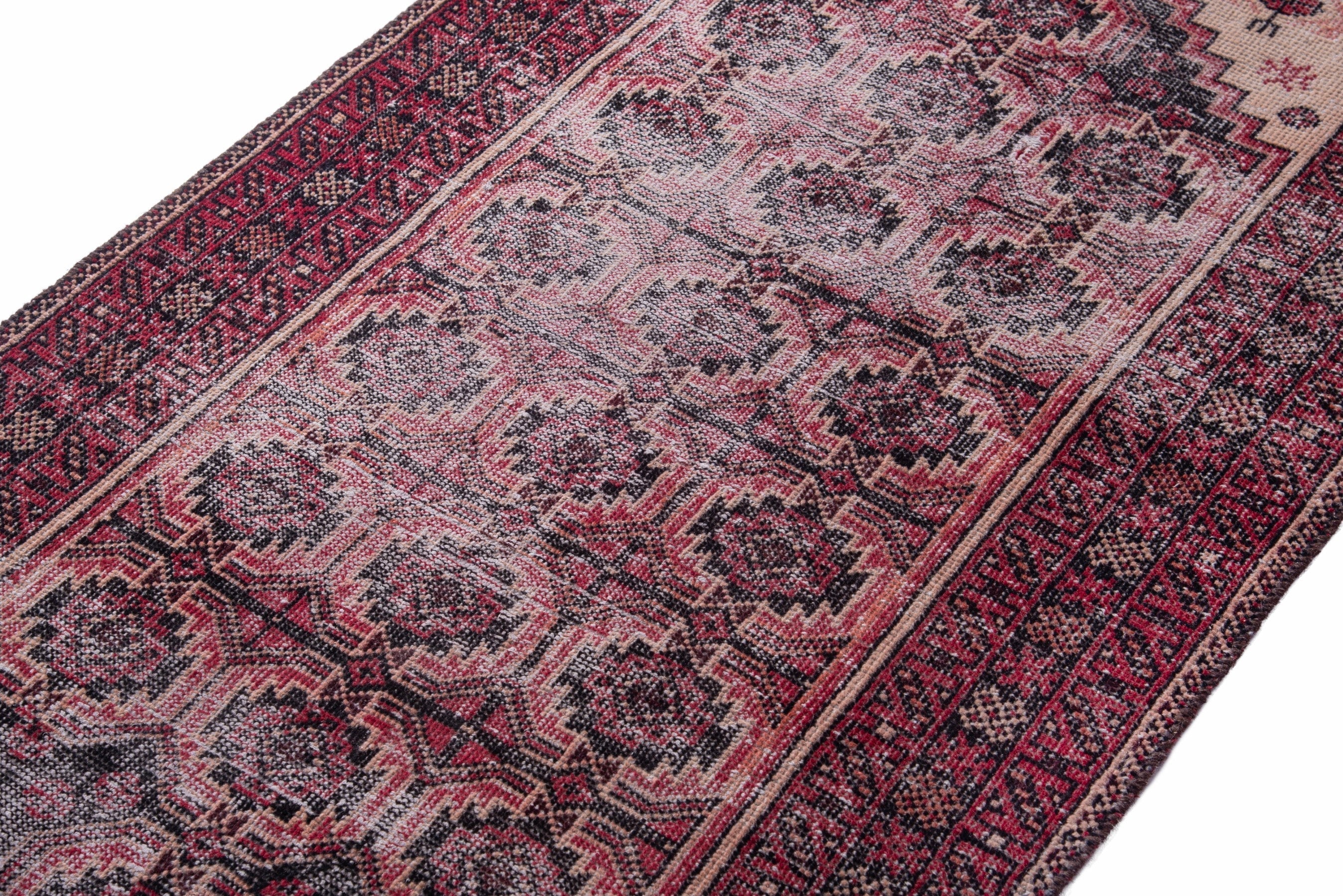 Persian Baluch runner rug in burgundy and faded red, view 4 of 15