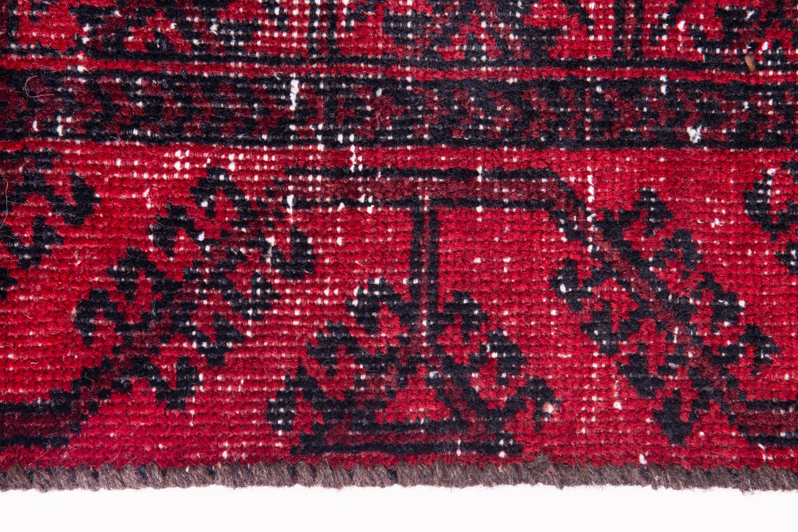Persian Baluch runner rug in deep red and faded red, view 9 of 17