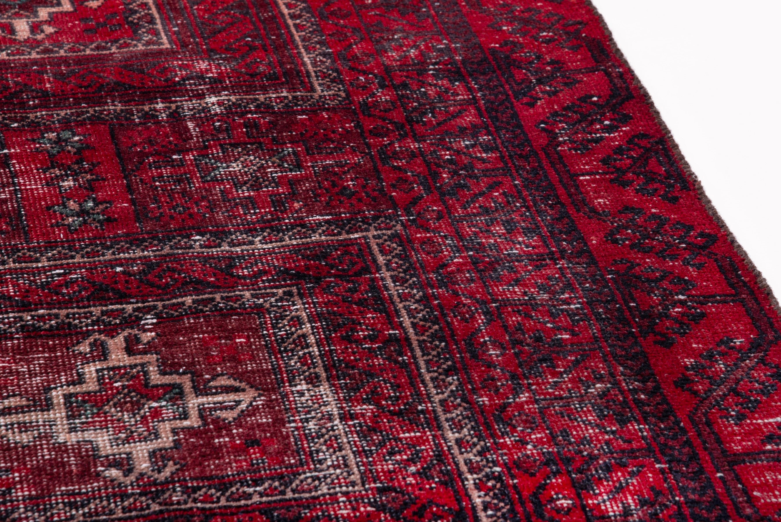 Persian Baluch runner rug in deep red and faded red, view 7 of 17
