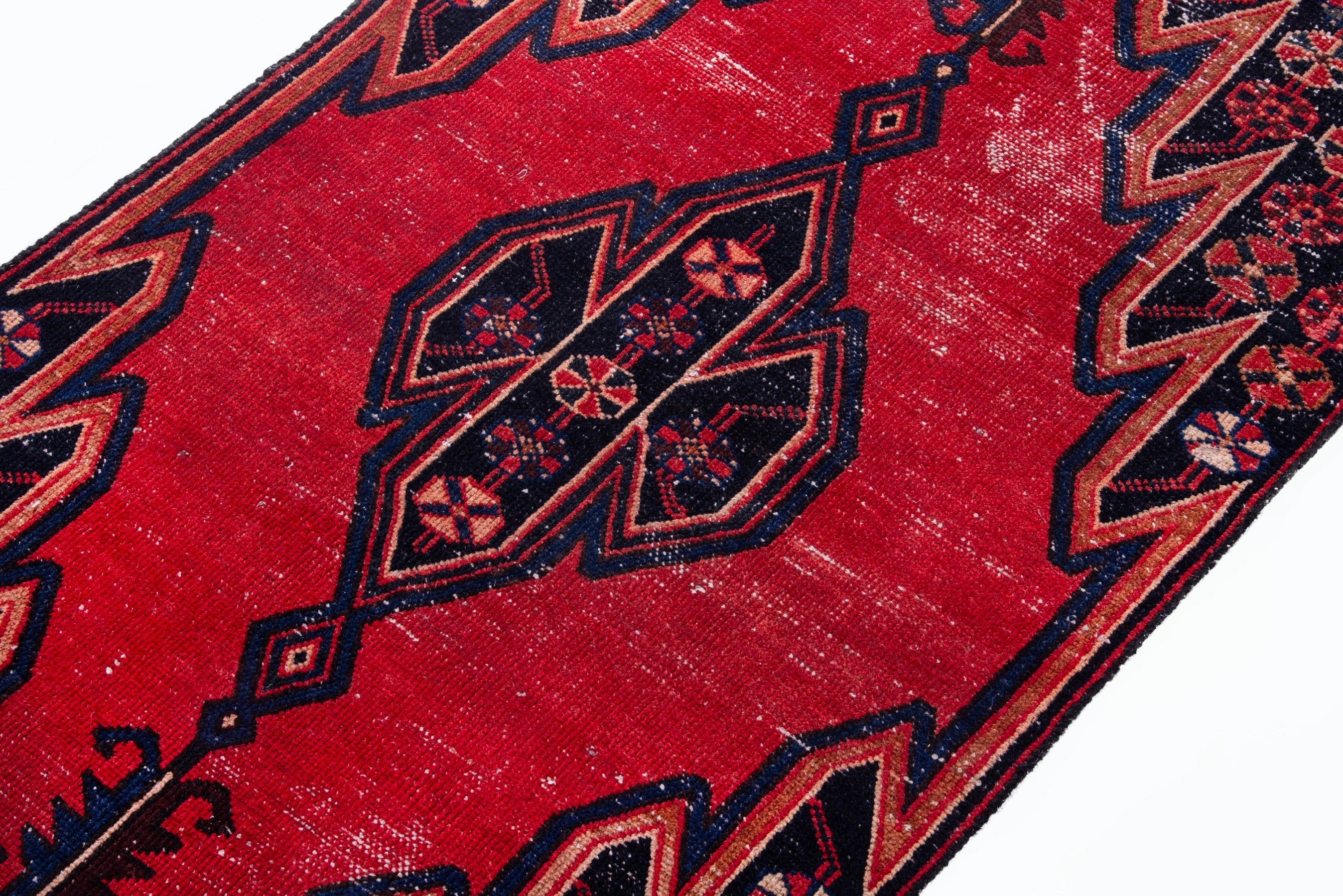 Persian Saveh accent rug in deep red and navy, view 4 of 17