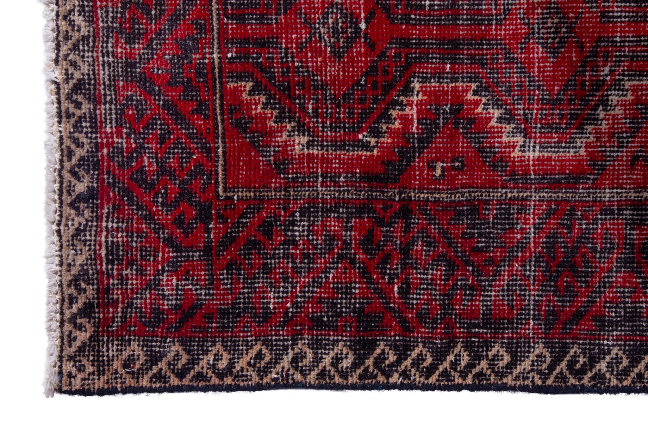 Persian Baluch runner rug in deep red and faded red, view 5 of 17