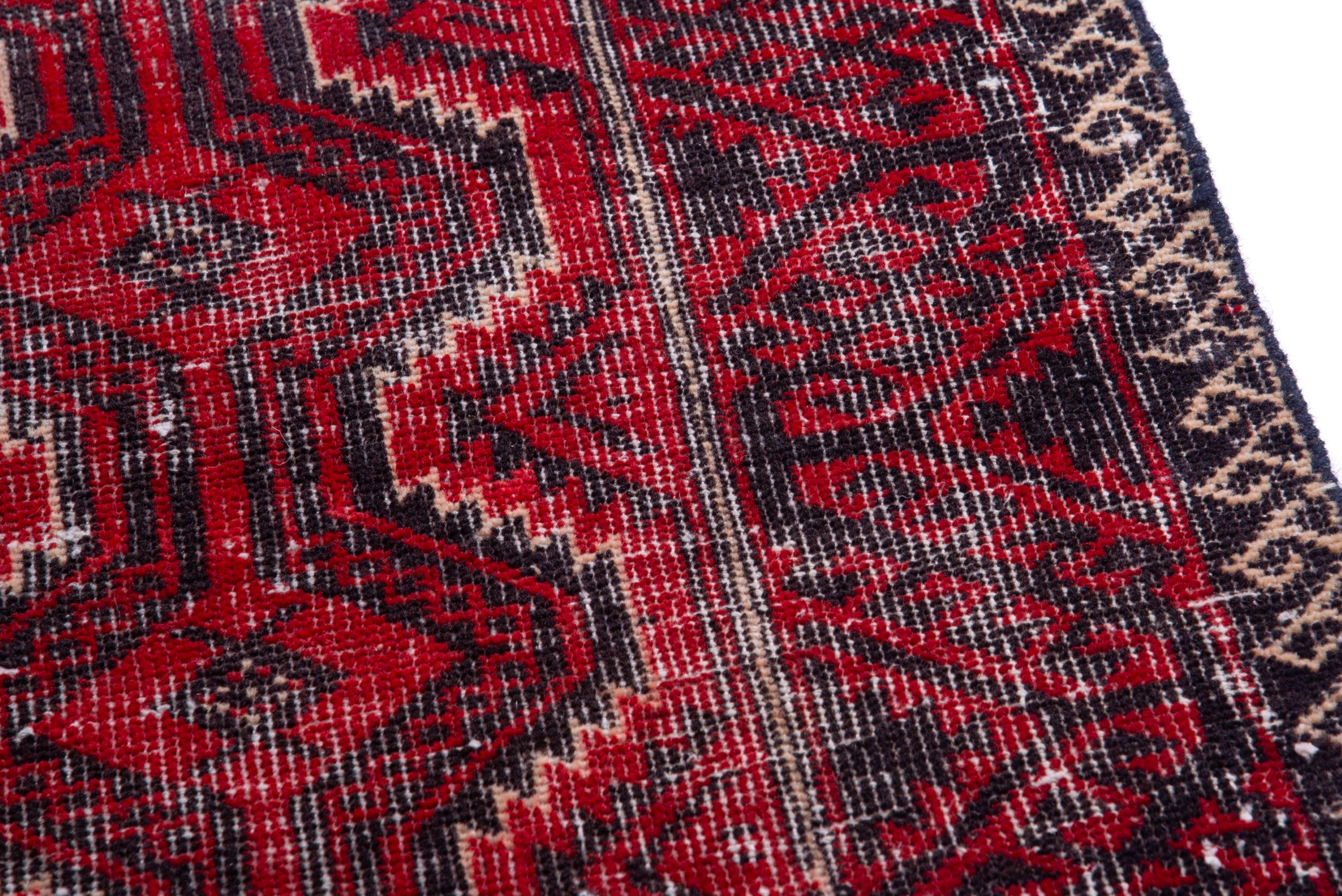 Persian Baluch runner rug in deep red and faded red, view 7 of 17