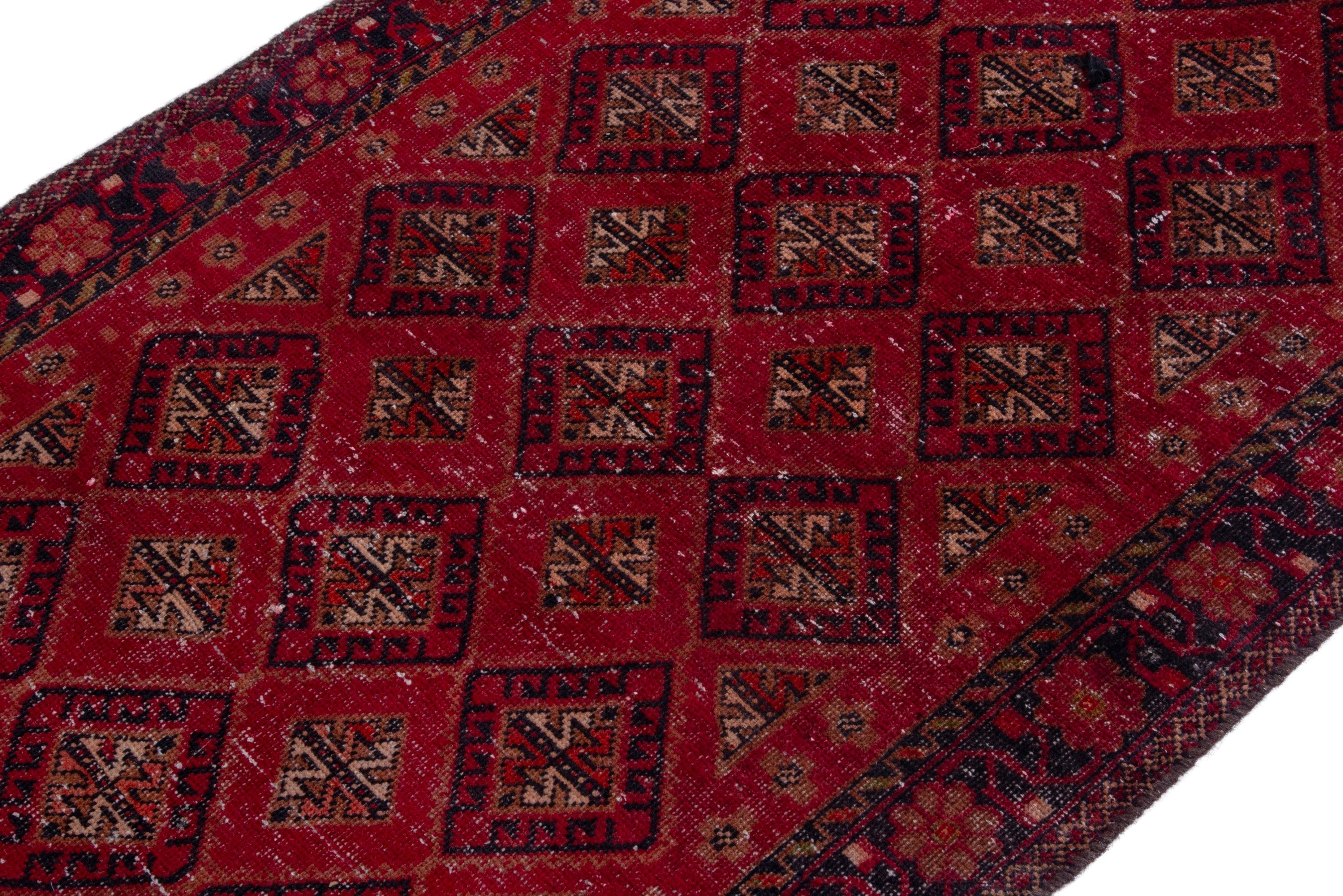 Persian Baluch accent rug in deep red and gold, view 6 of 20