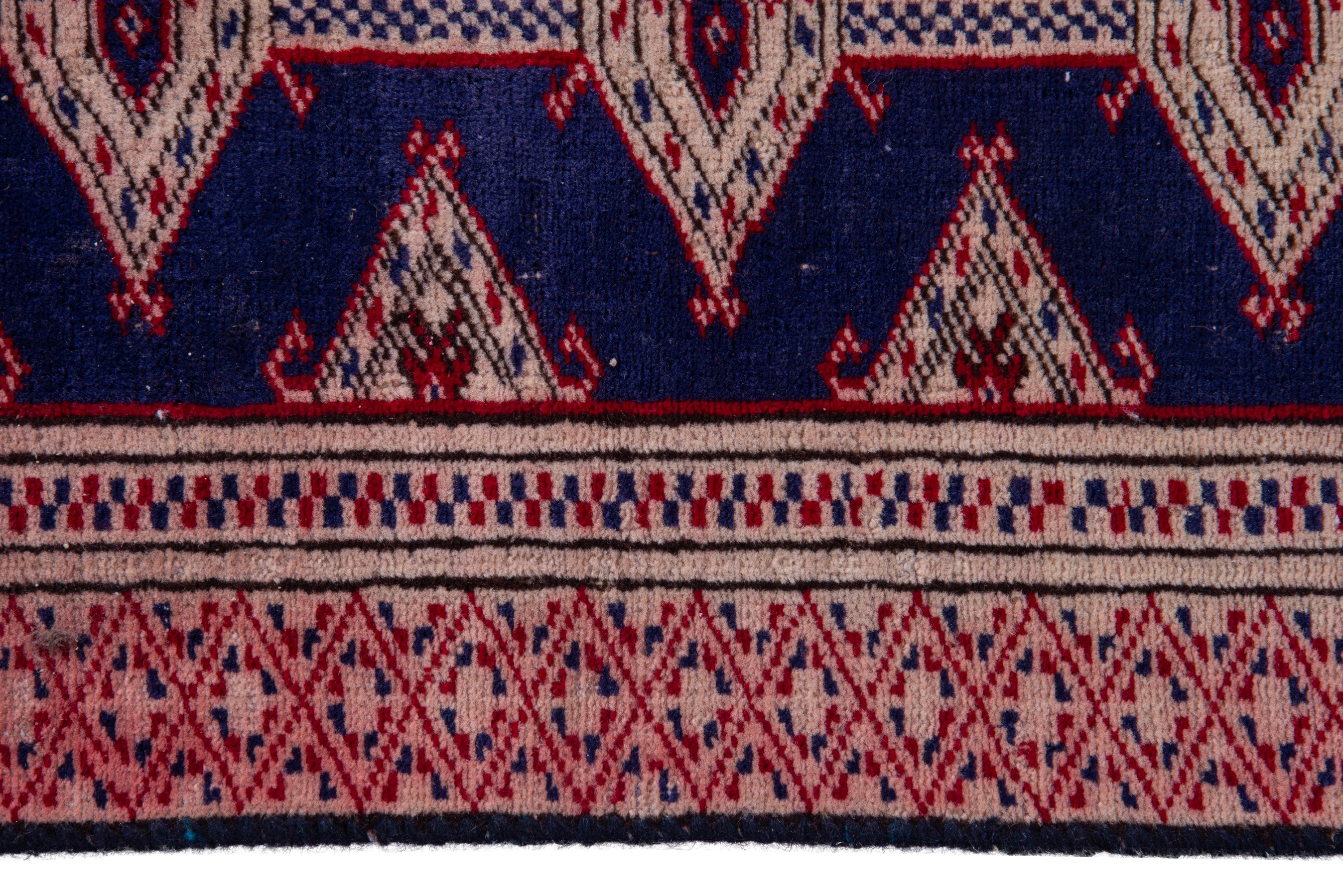 Persian Torkaman accent rug in navy and rose, view 11 of 15