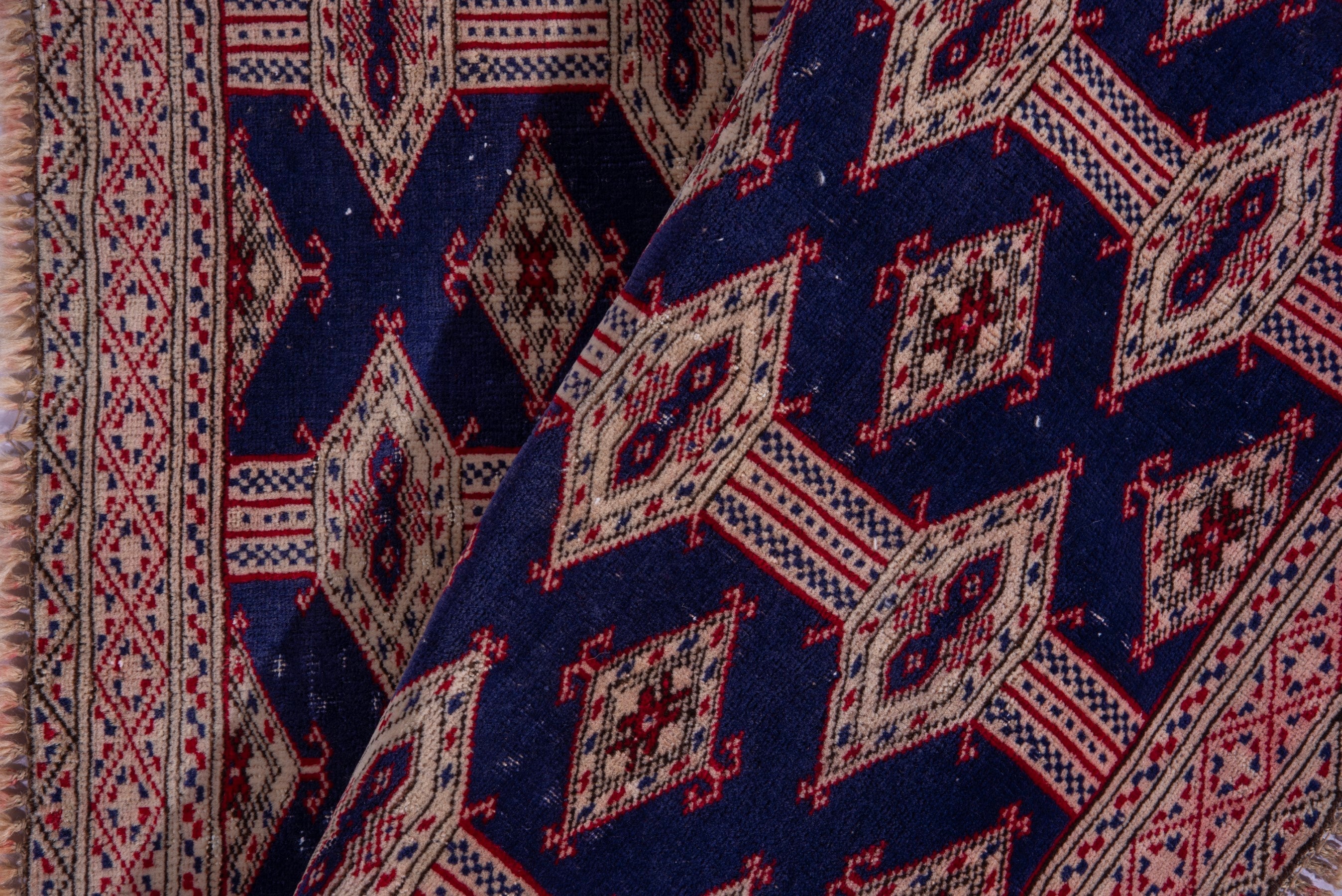 Persian Torkaman accent rug in navy and rose, view 13 of 15