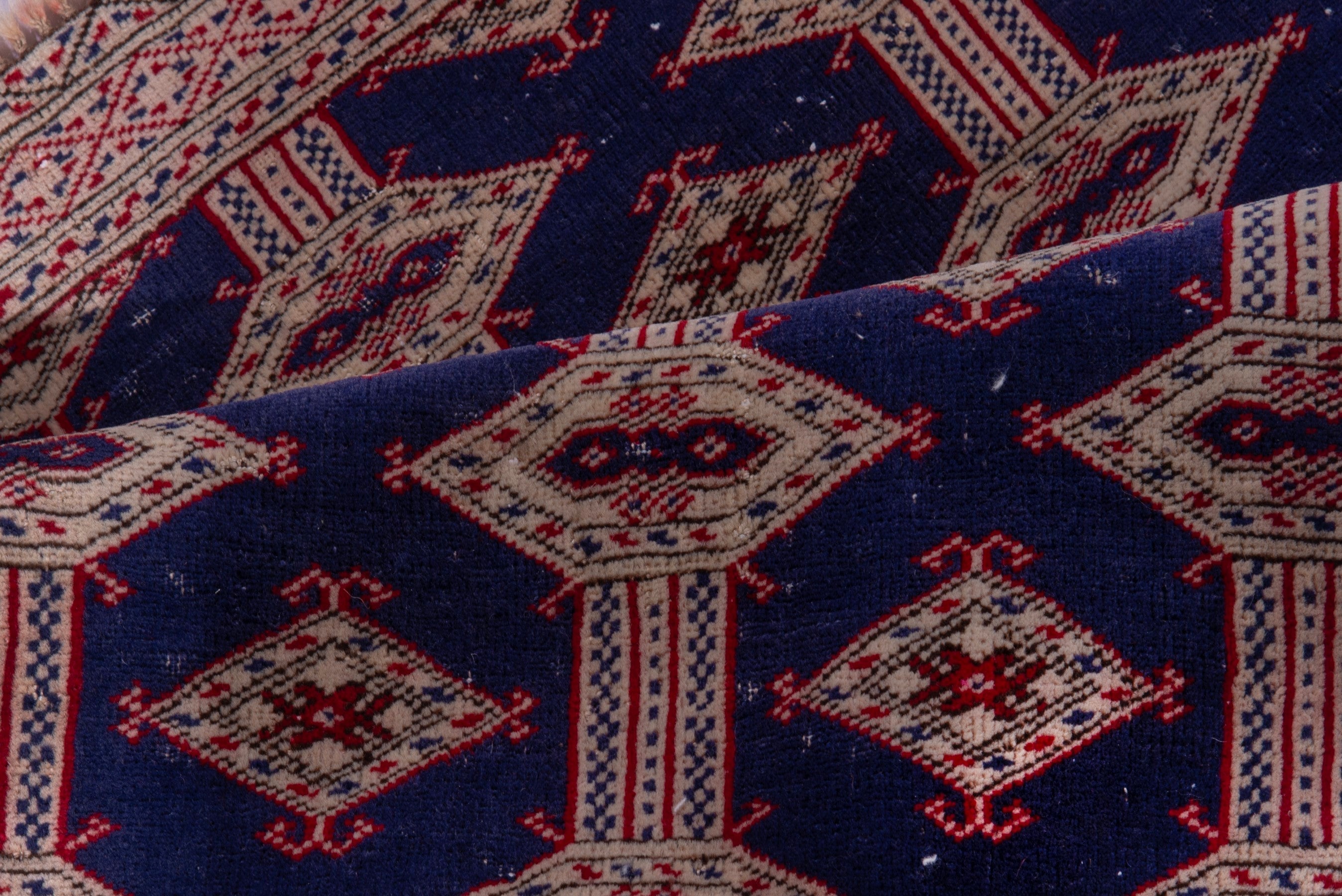 Persian Torkaman accent rug in navy and rose, view 14 of 15