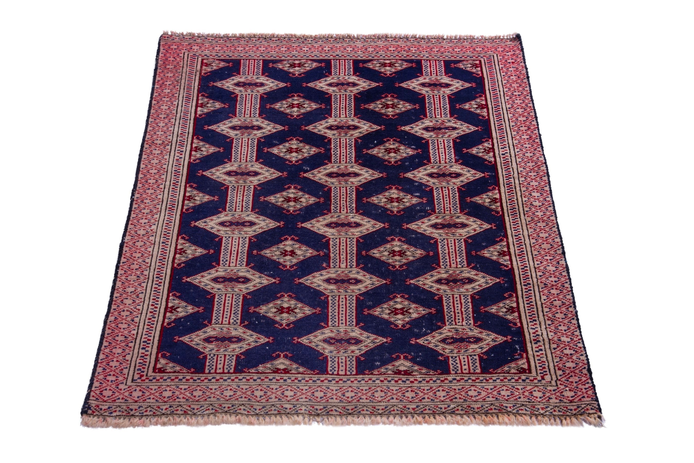 Persian Torkaman accent rug in navy and rose, view 2 of 15