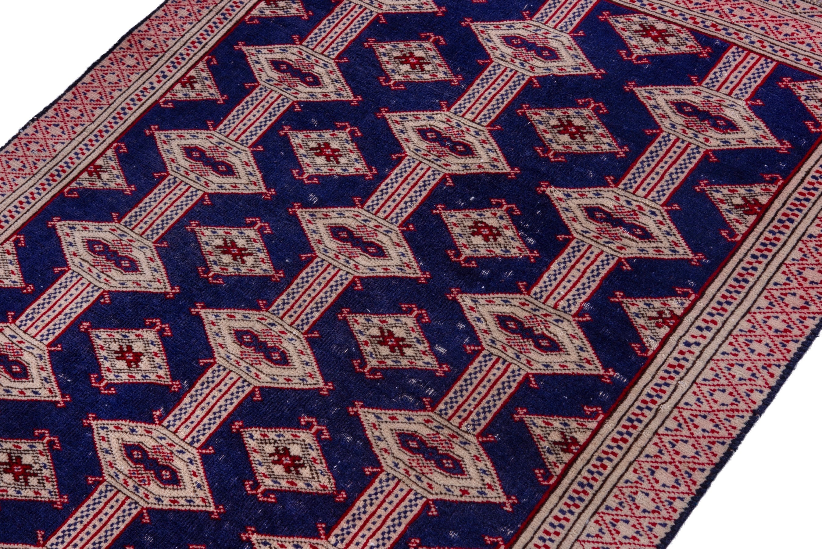 Persian Torkaman accent rug in navy and rose, view 6 of 15