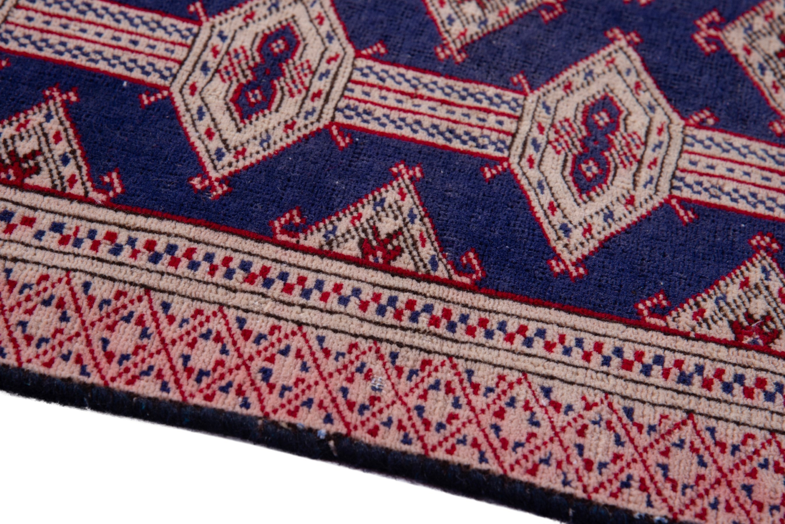 Persian Torkaman accent rug in navy and rose, view 8 of 15