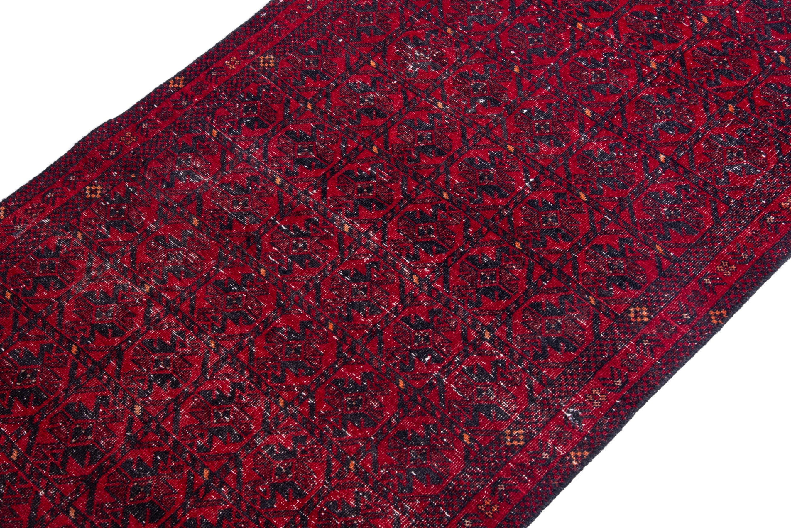 Persian Baluch runner rug in deep red and burgundy, view 6 of 17