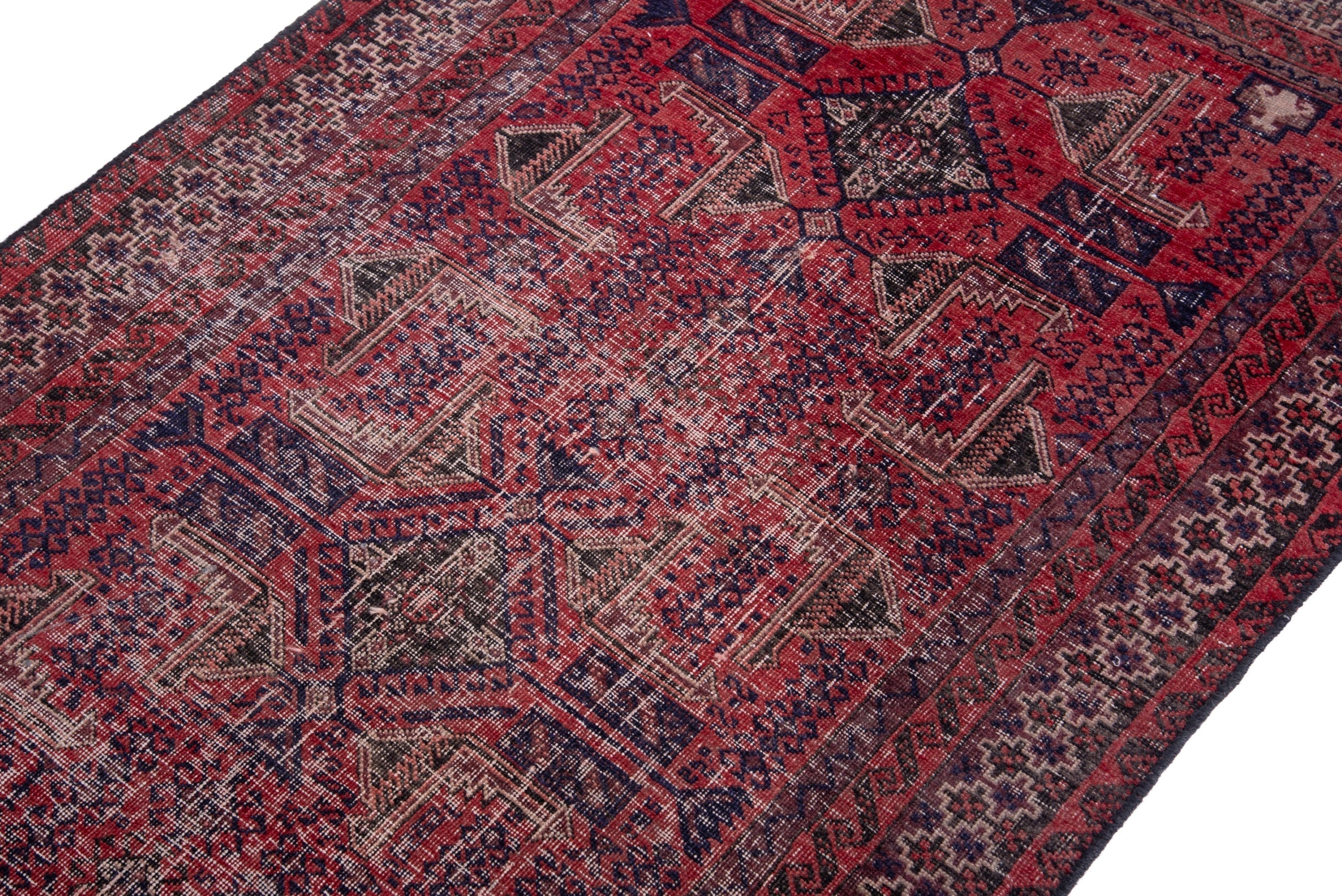 Persian Baluch accent rug in deep red and faded red, view 6 of 15