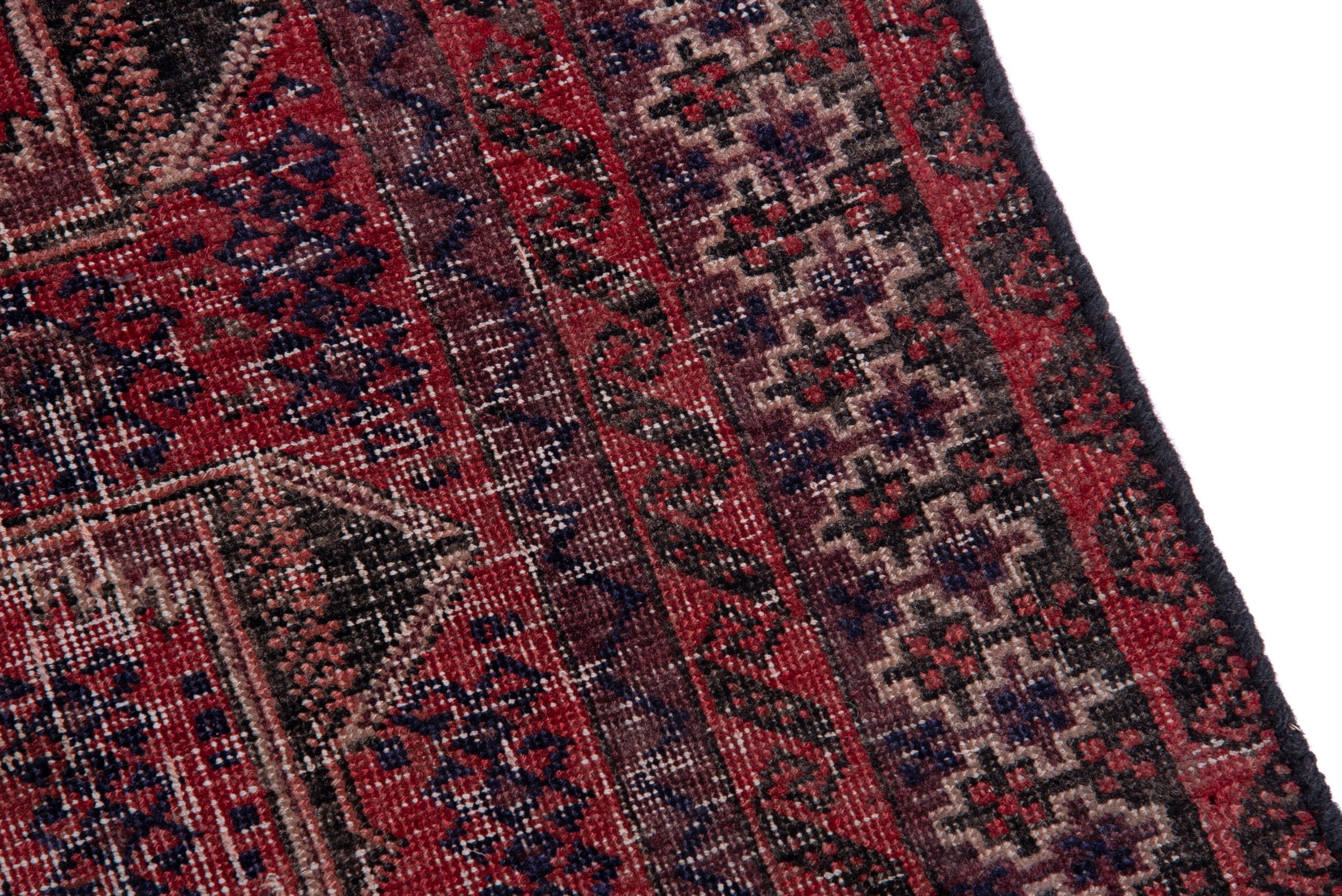 Persian Baluch accent rug in deep red and faded red, view 7 of 15
