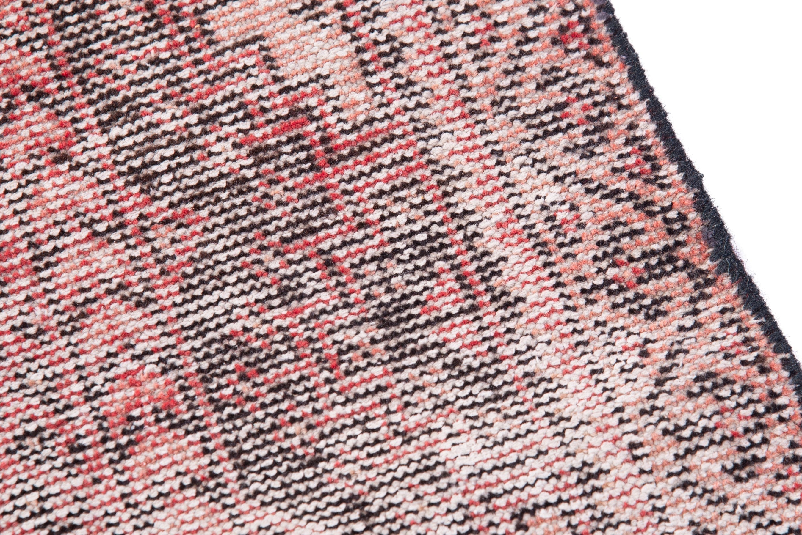 Persian Ferdos area rug in muted pink and dusty rose, view 7 of 17