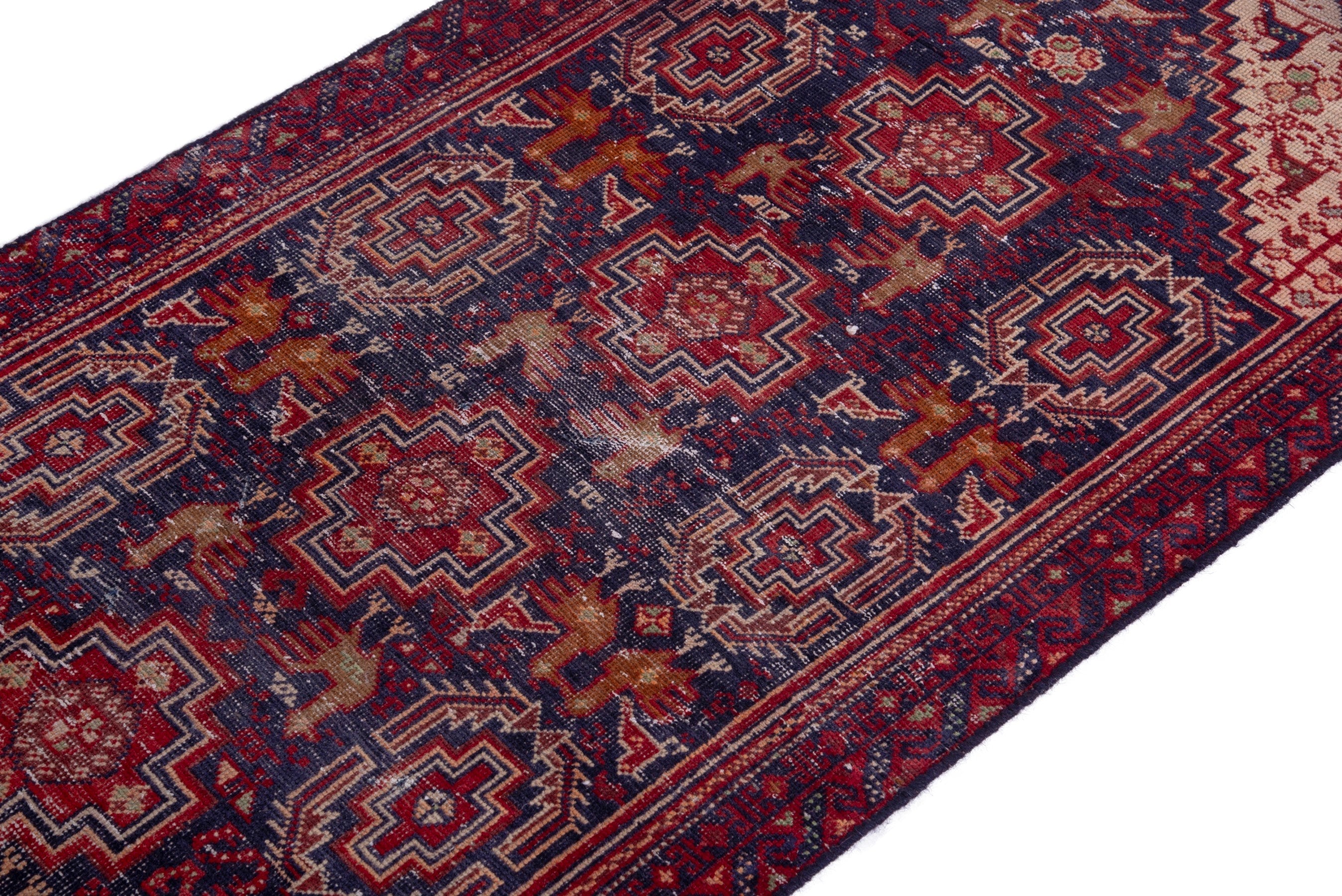 Persian Baluch accent rug in burgundy and navy, view 6 of 15
