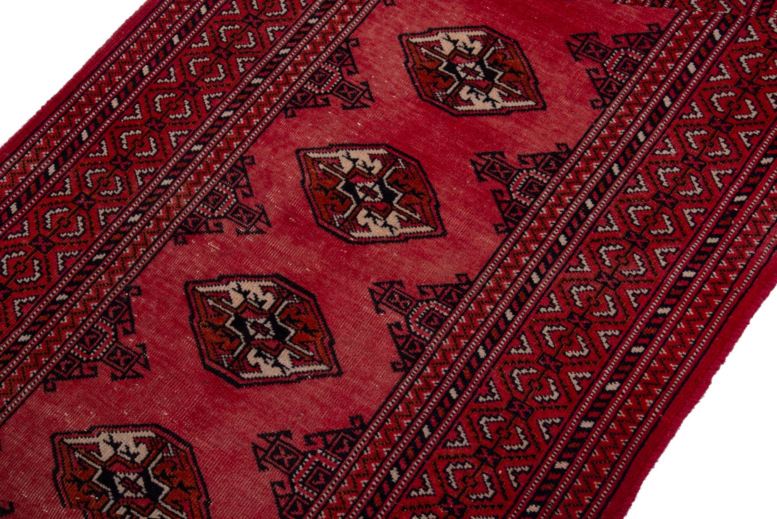 Persian Torkaman runner rug in deep red and cream, view 6 of 17