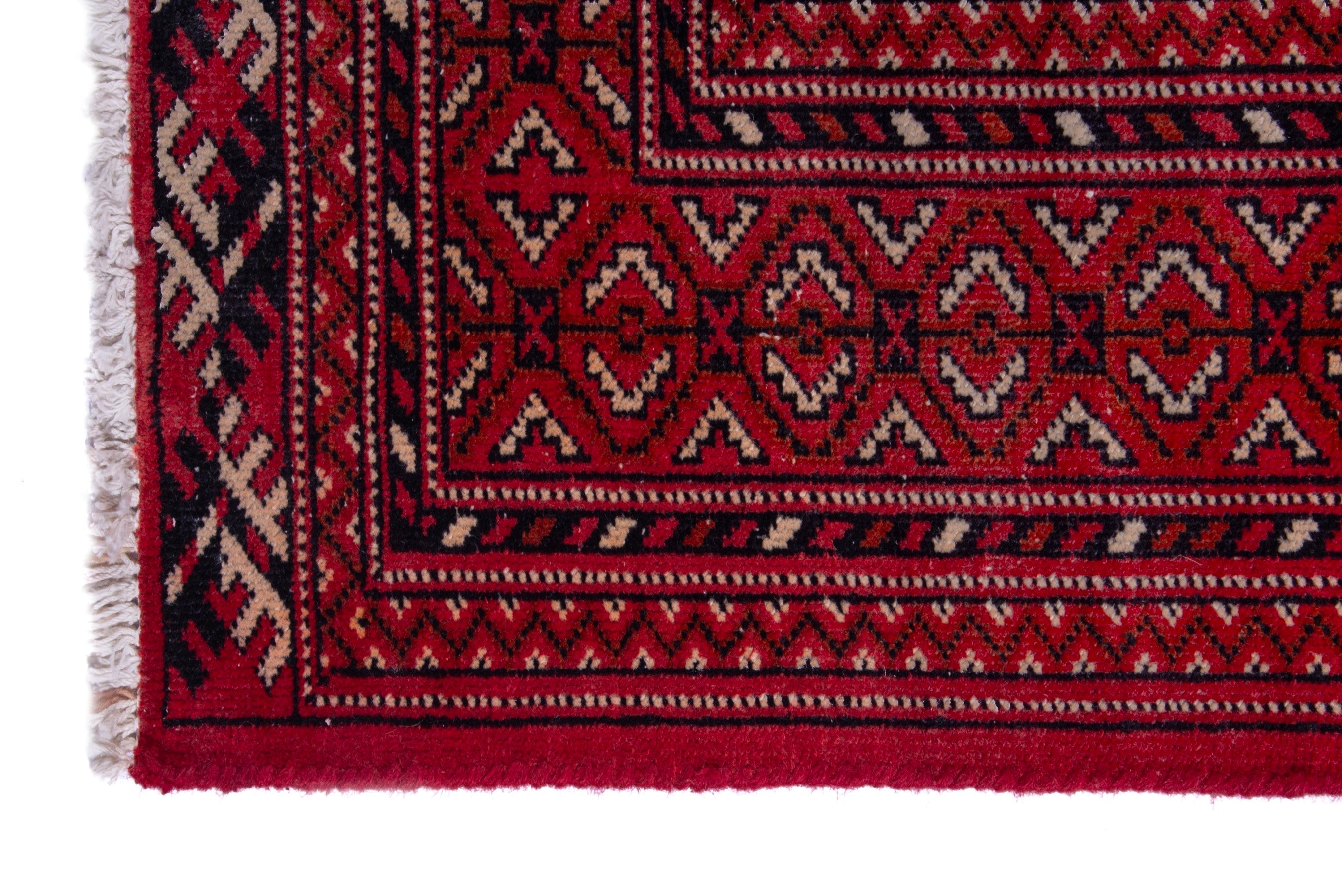 Persian Torkaman runner rug in deep red and cream, view 5 of 17