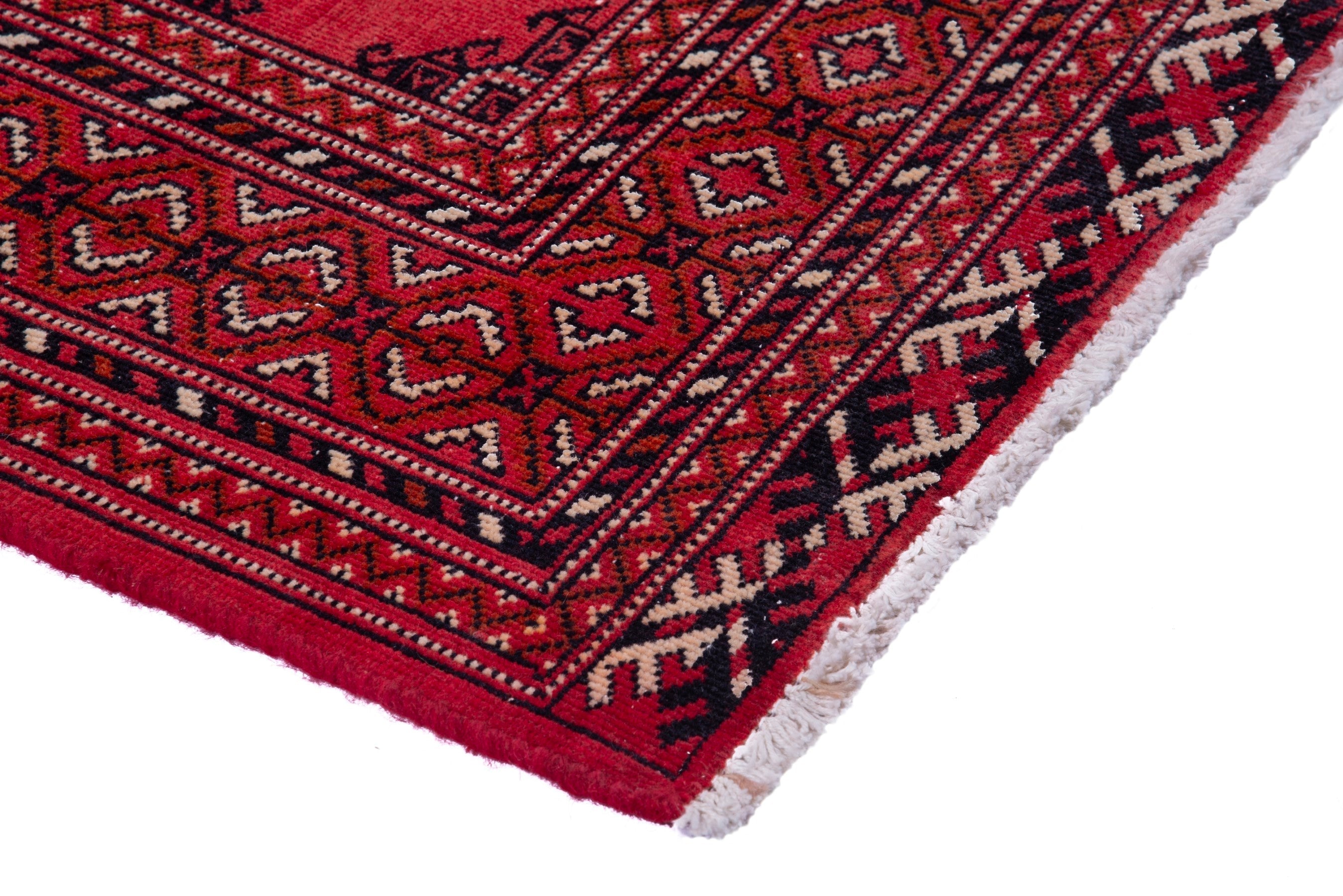 Persian Torkaman runner rug in deep red and cream, view 4 of 17