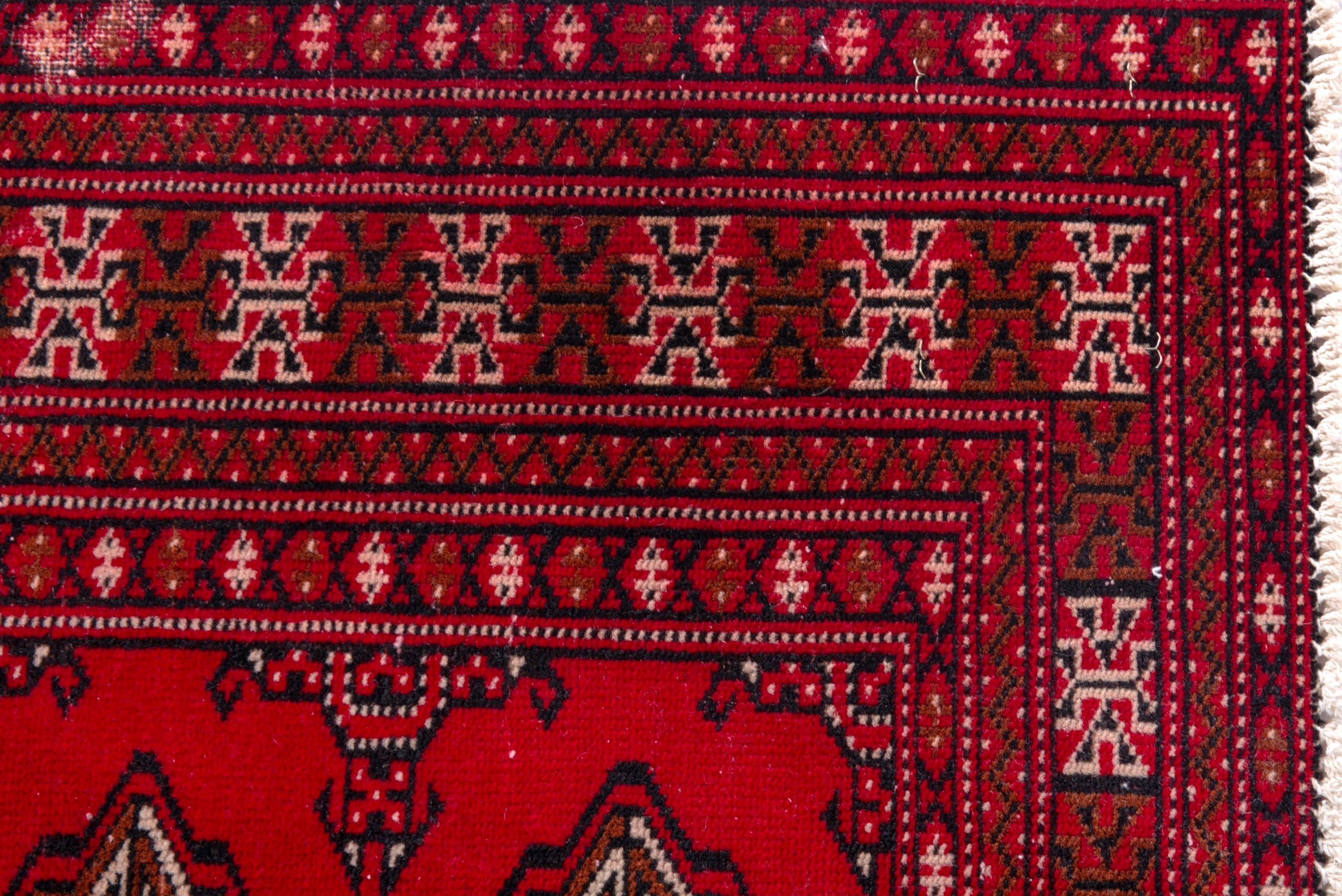 Persian Torkaman accent rug in deep red and tan, view 11 of 17