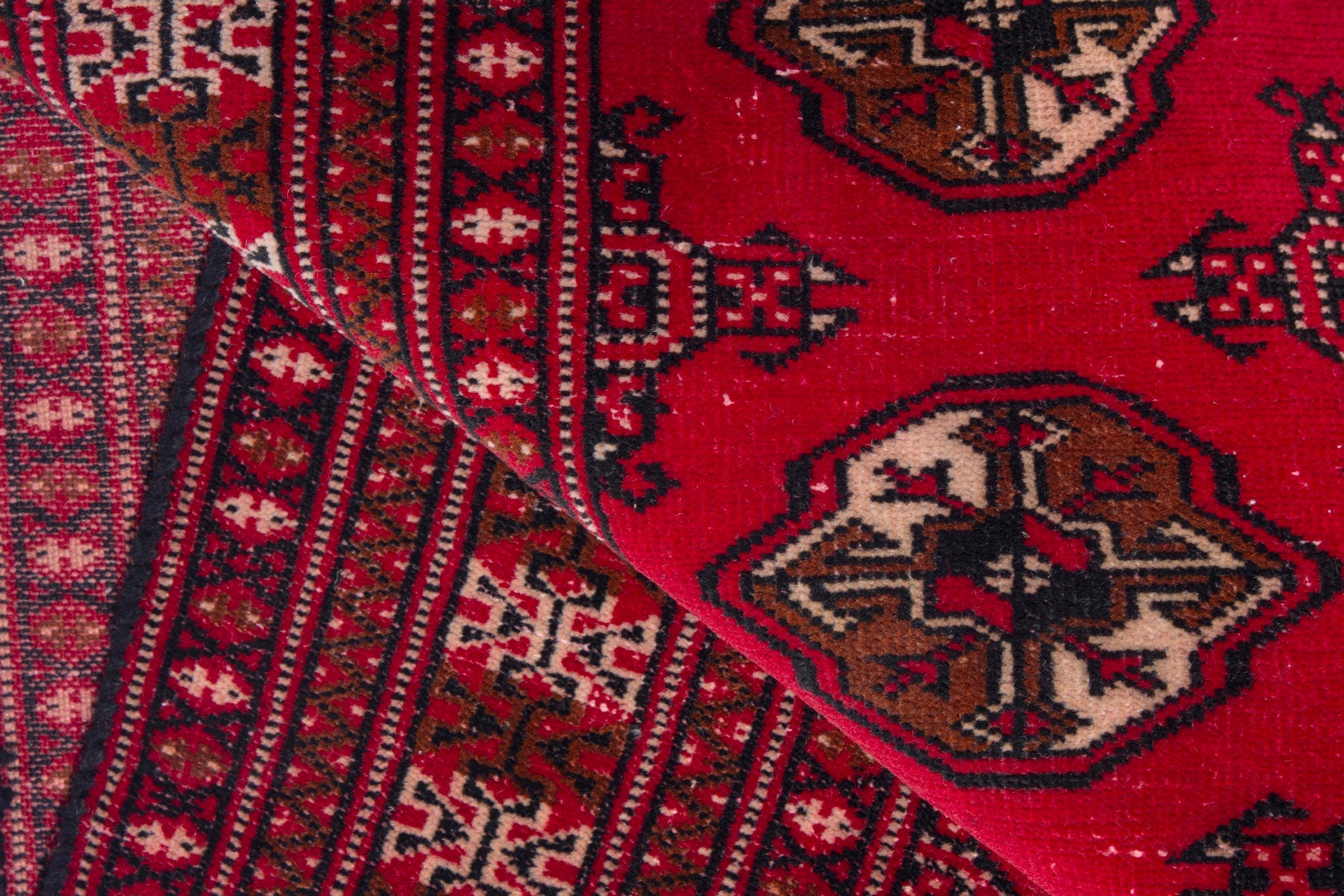 Persian Torkaman accent rug in deep red and tan, view 16 of 17