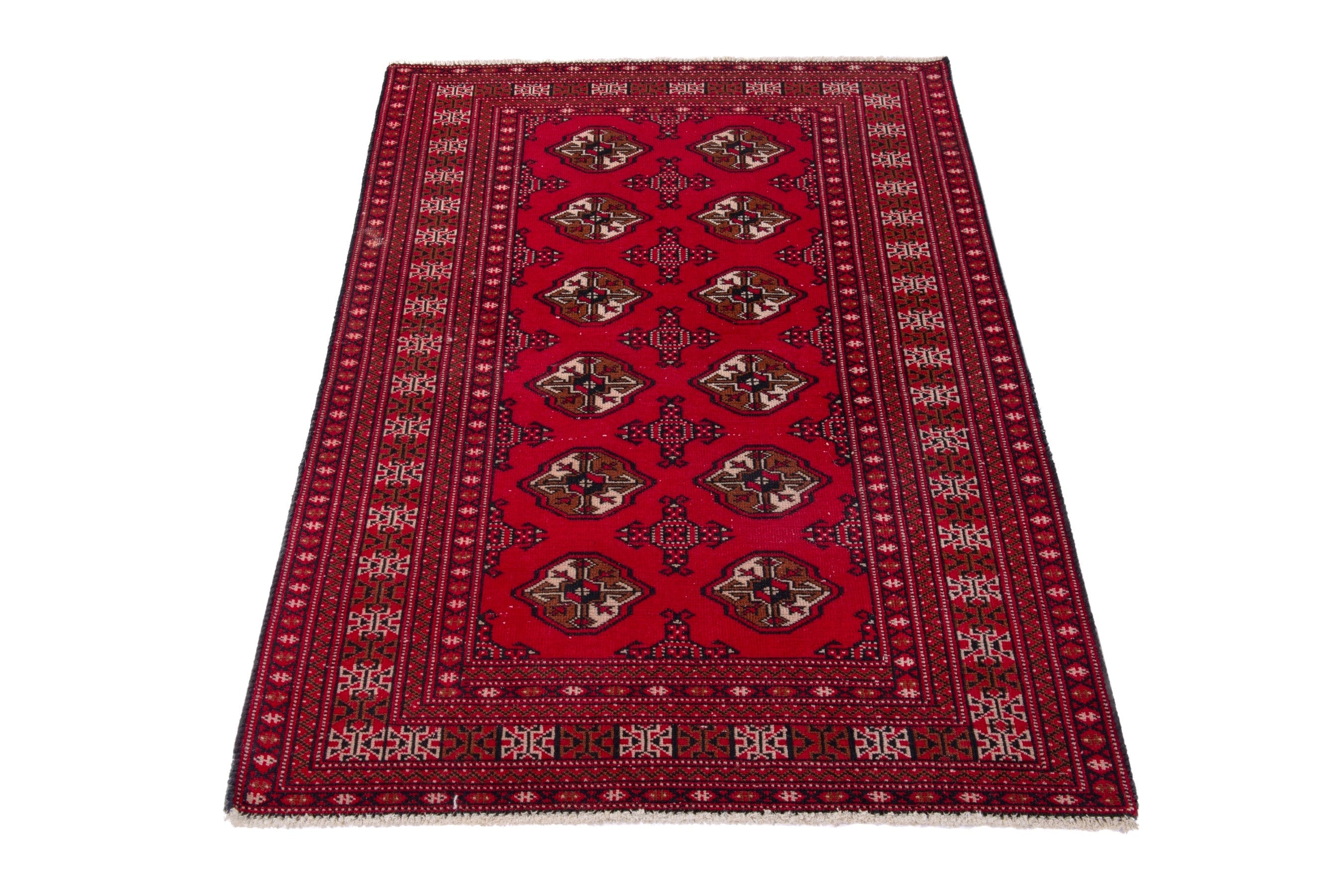 Persian Torkaman accent rug in deep red and tan, view 3 of 17