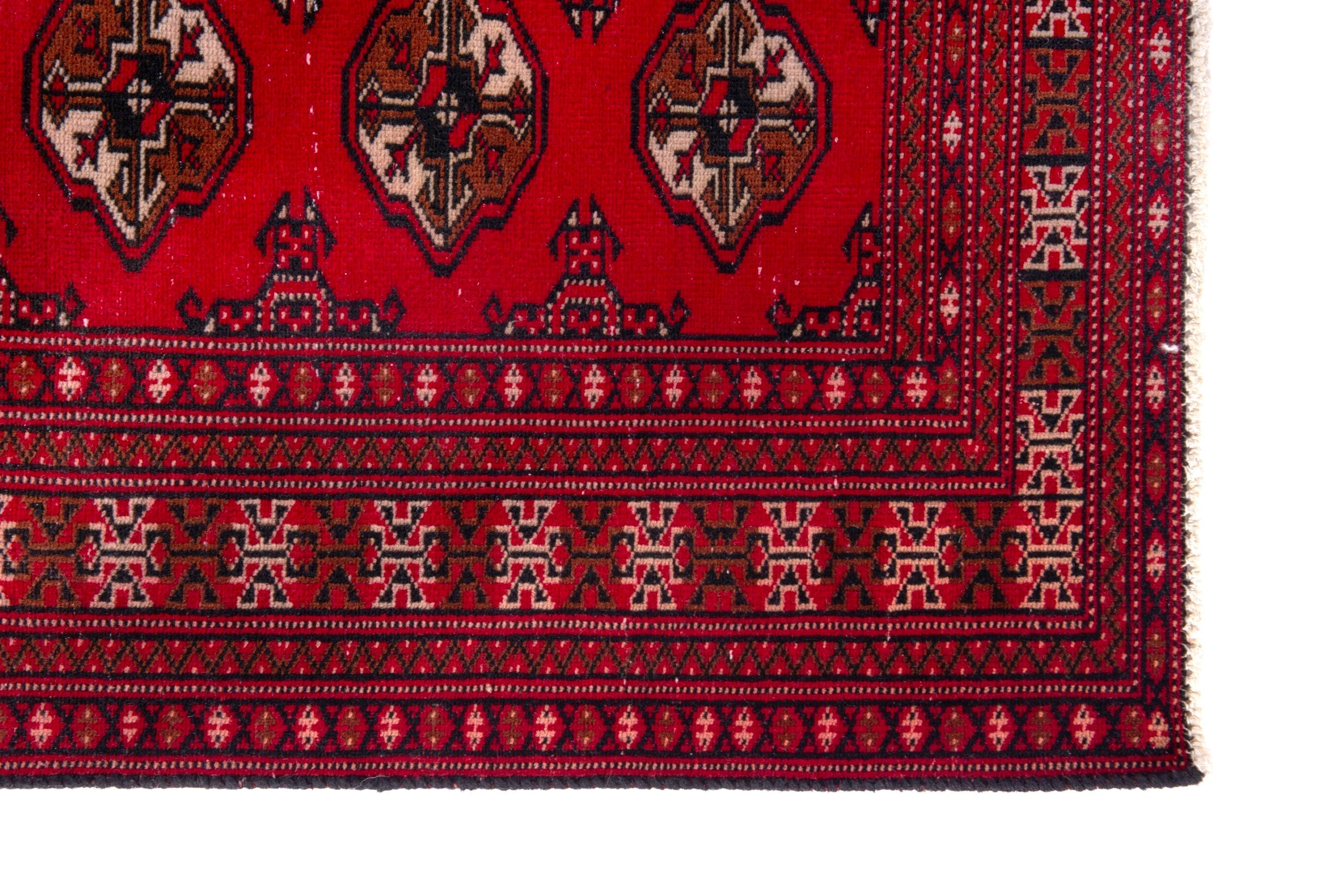 Persian Torkaman accent rug in deep red and tan, view 5 of 17