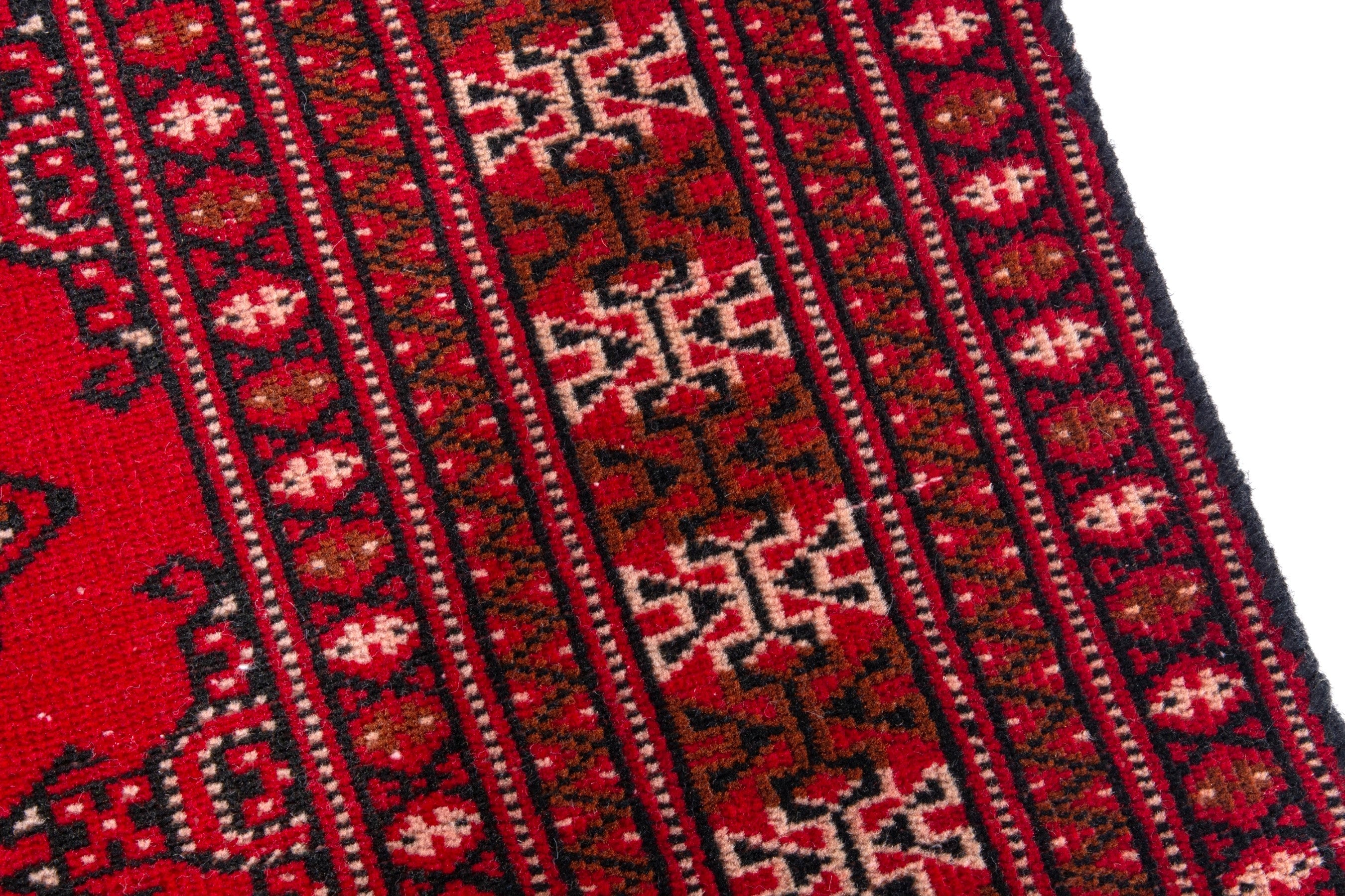 Persian Torkaman accent rug in deep red and tan, view 7 of 17