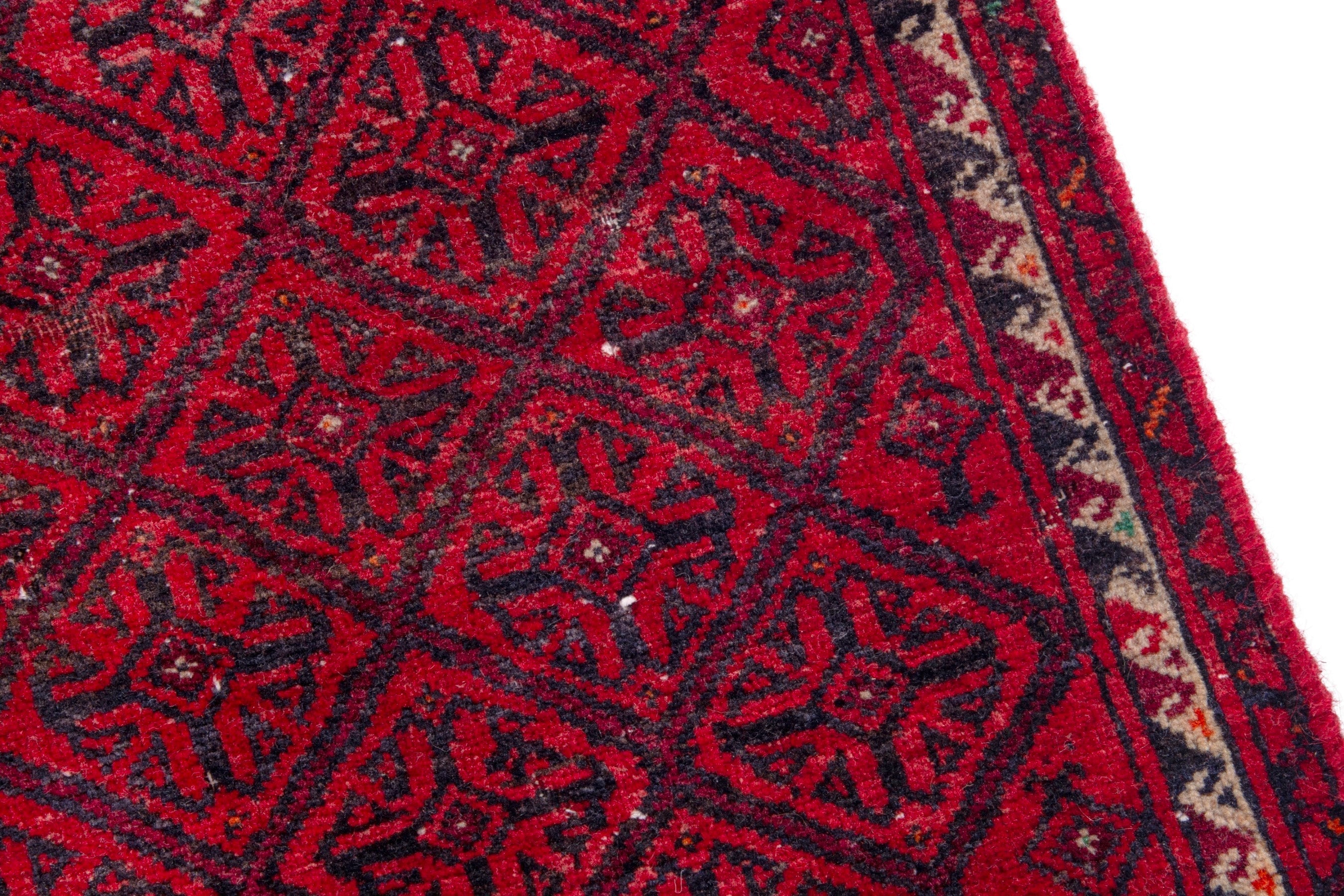 Persian Baluch accent rug in deep red and burgundy, view 7 of 17