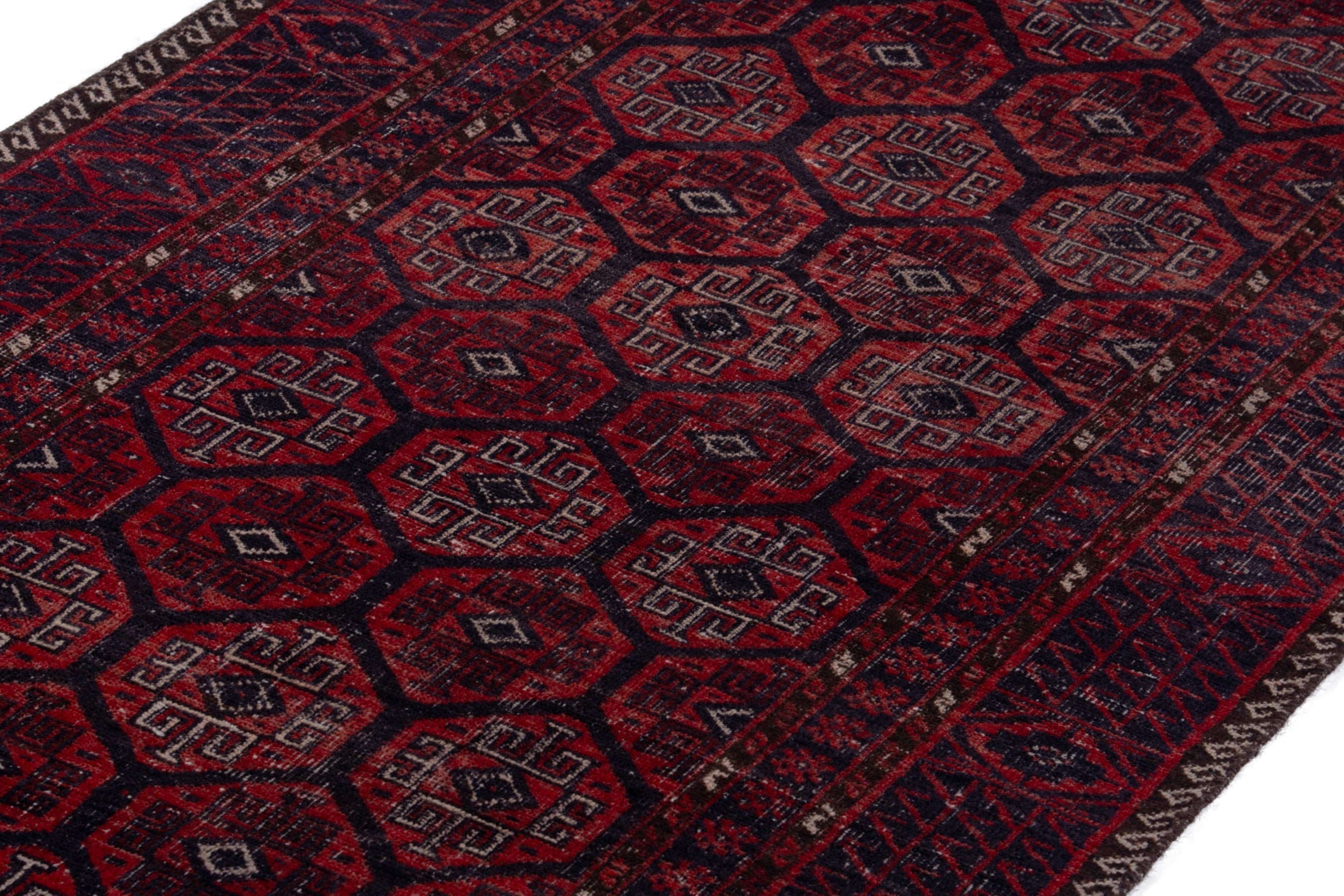 Persian Baluch runner rug in burgundy and faded red, view 6 of 16