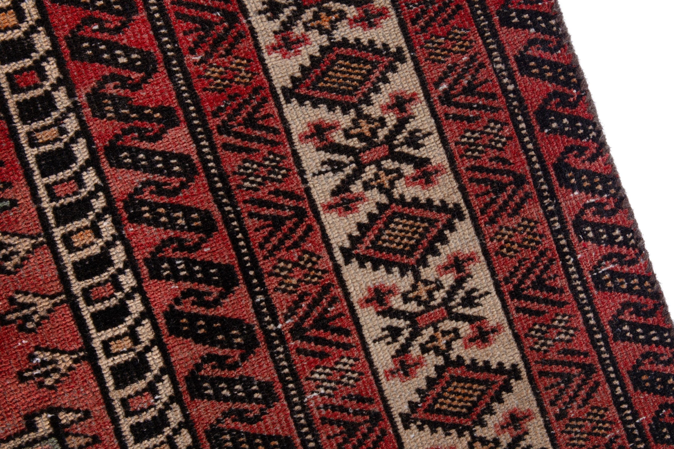 Persian Baluch area rug in deep red and cream, view 7 of 17
