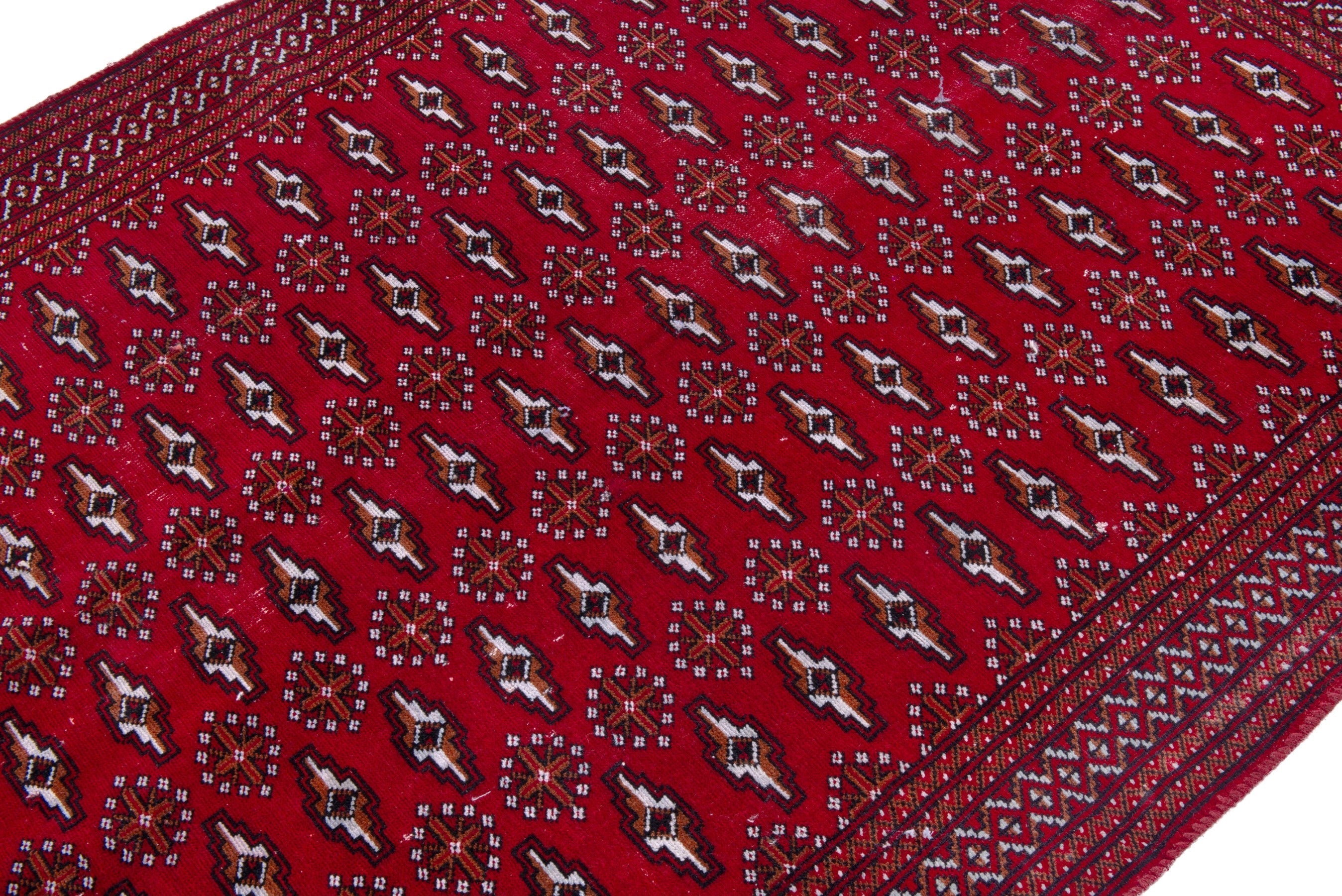 Persian Torkaman accent rug in burgundy and deep red, view 6 of 18