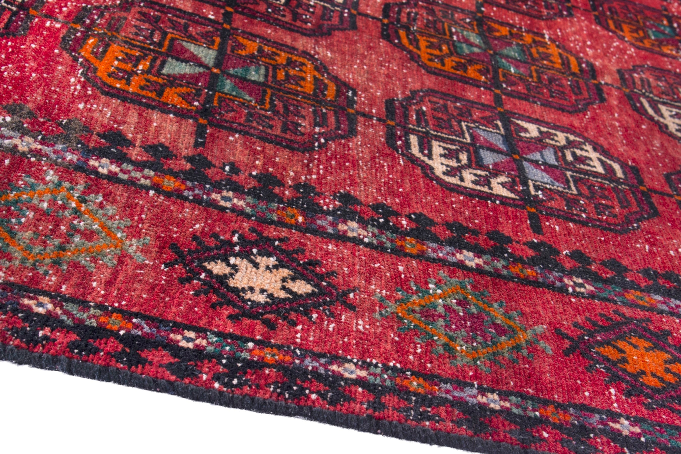 Persian Ghoochan area rug in deep red and faded red, view 8 of 19