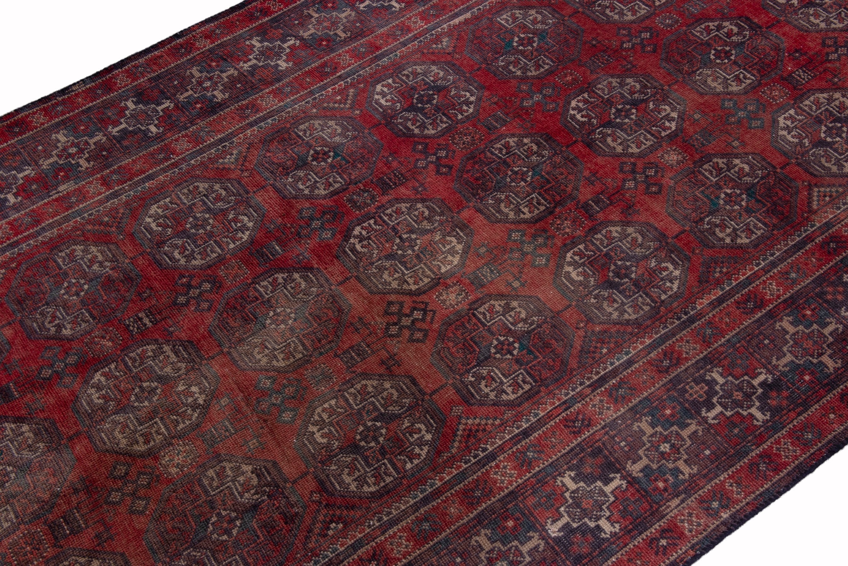 Persian Baluch runner rug in deep red and ochre, view 6 of 17