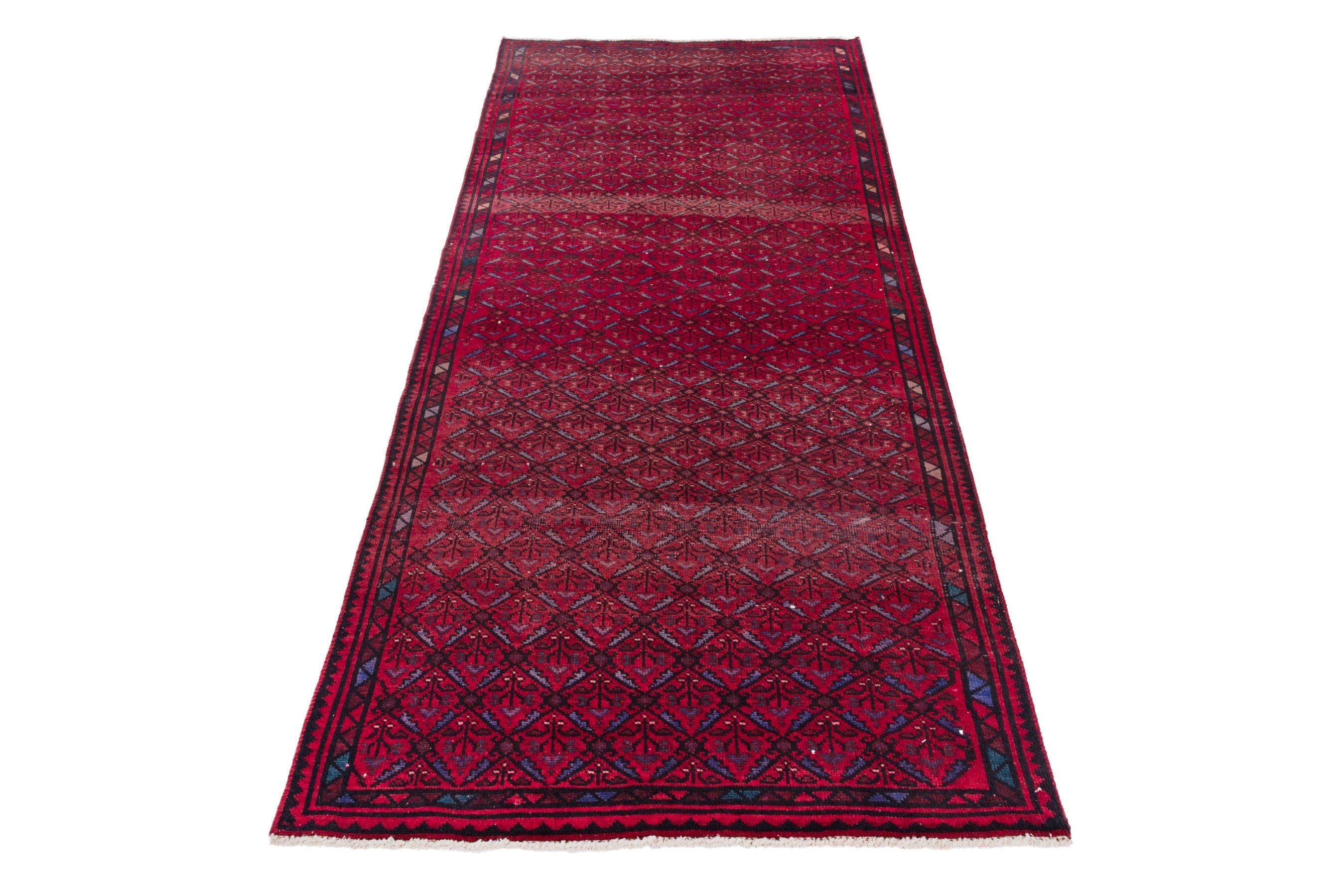 Persian Baluch runner rug in deep red and burgundy, view 3 of 17