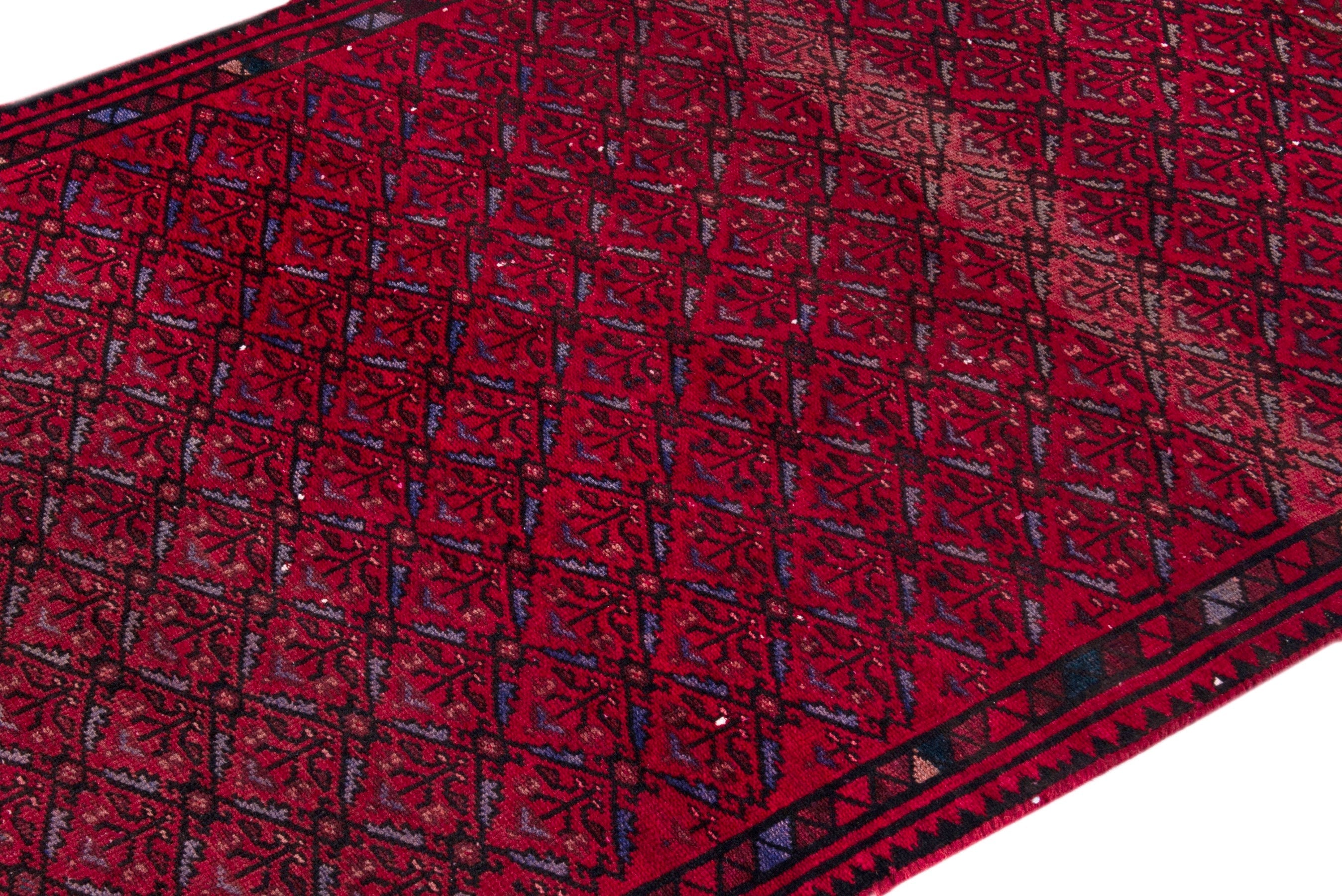 Persian Baluch runner rug in deep red and burgundy, view 6 of 17