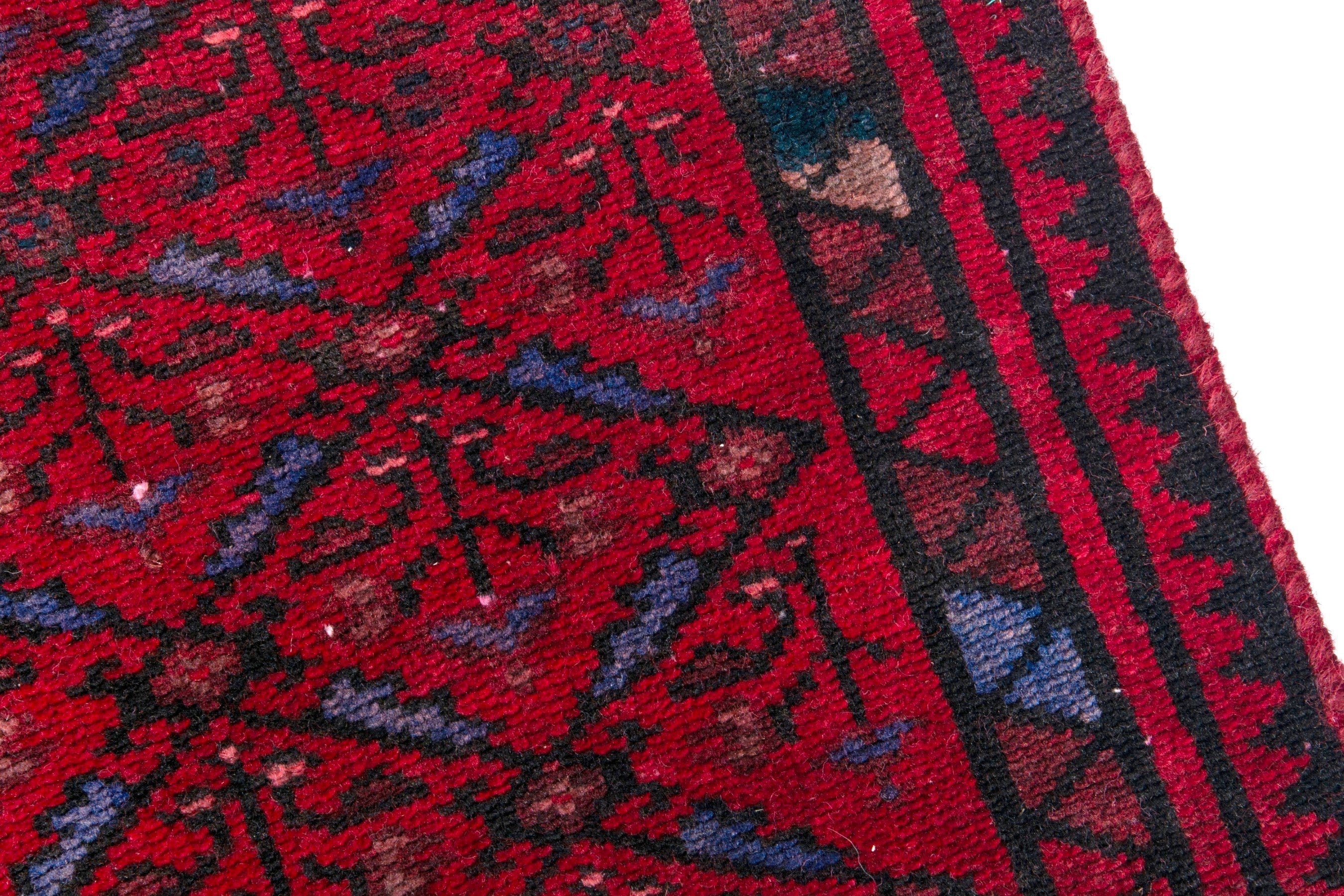 Persian Baluch runner rug in deep red and burgundy, view 7 of 17