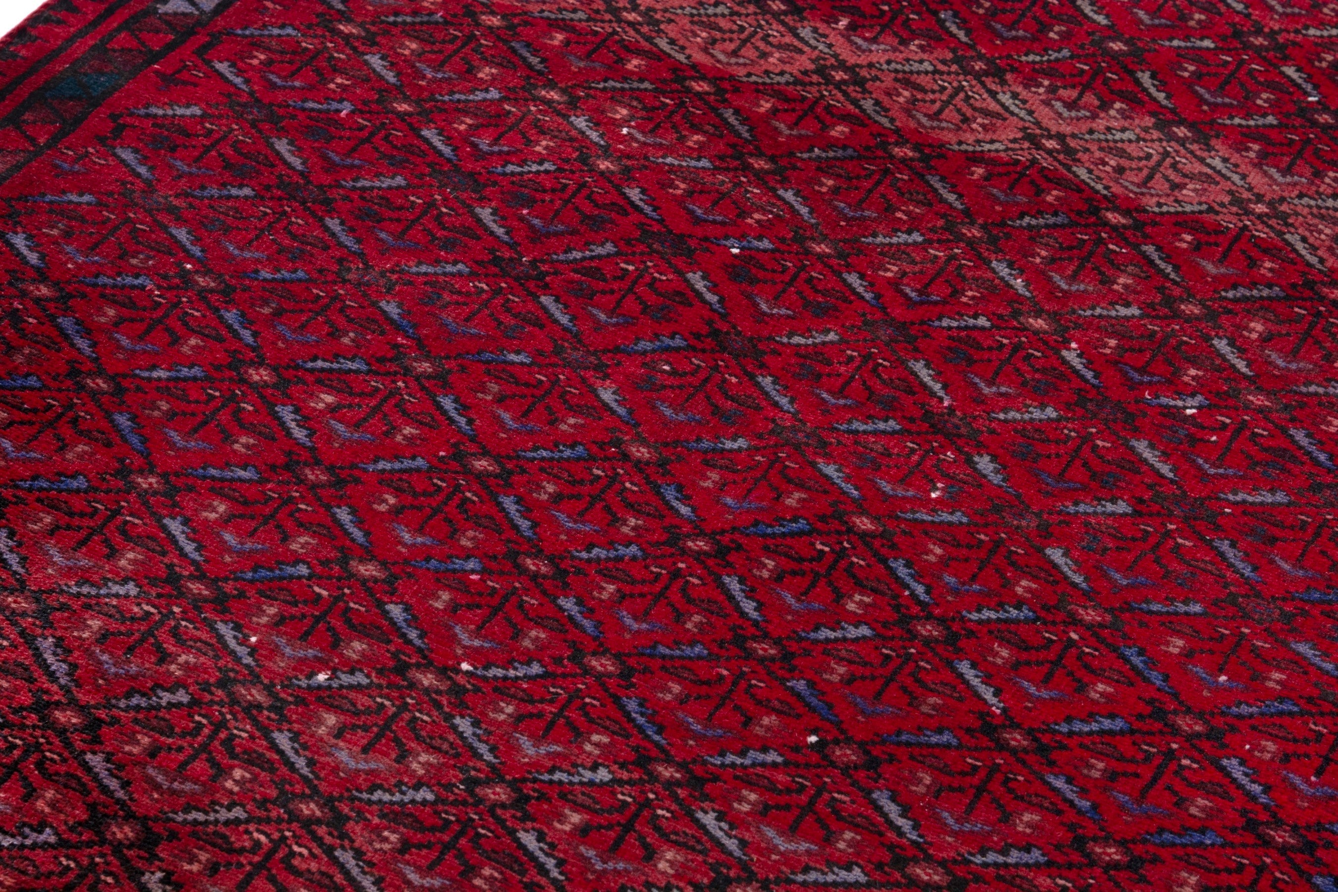 Persian Baluch runner rug in deep red and burgundy, view 9 of 17