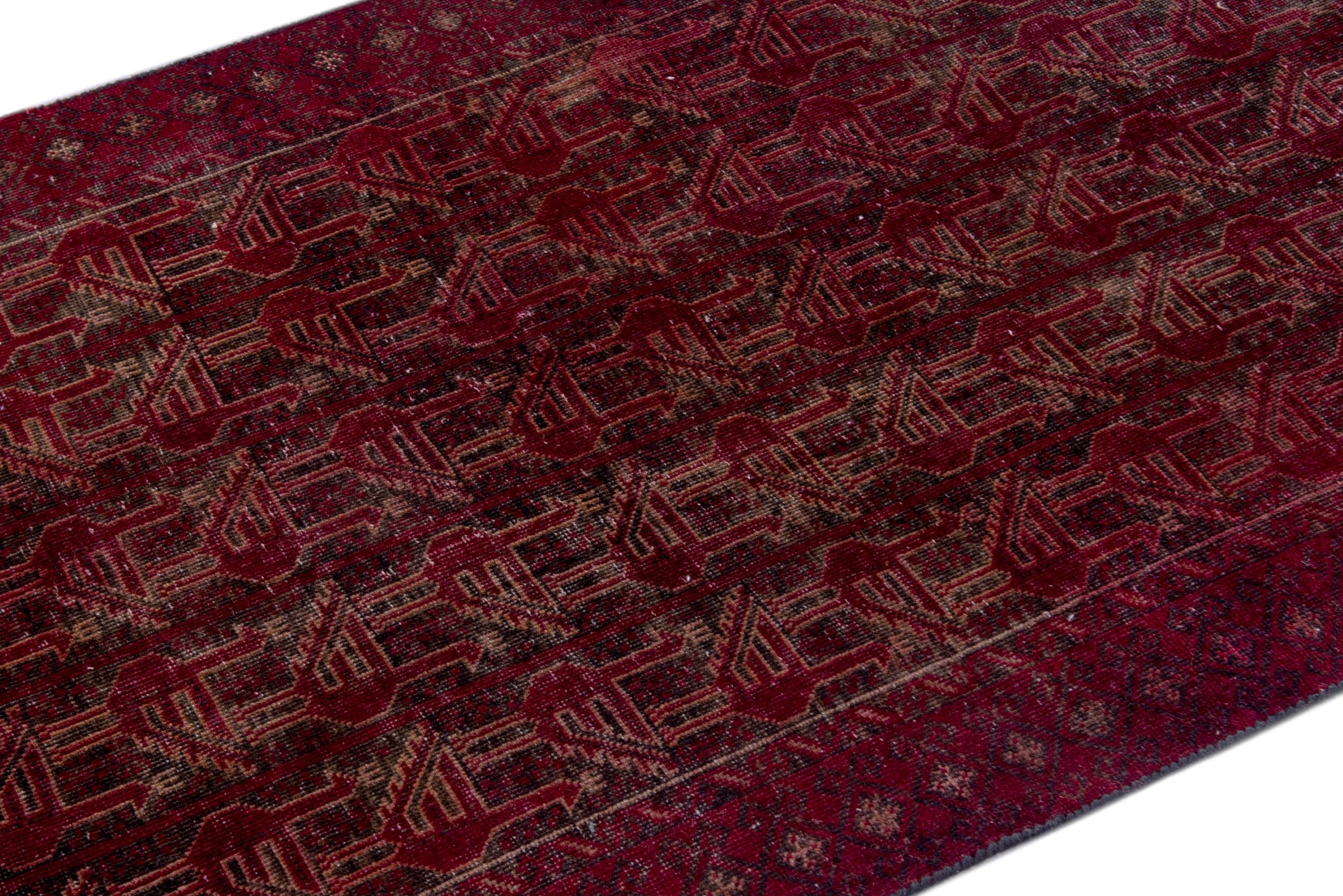 Persian Baluch accent rug in burgundy and faded red, view 6 of 17