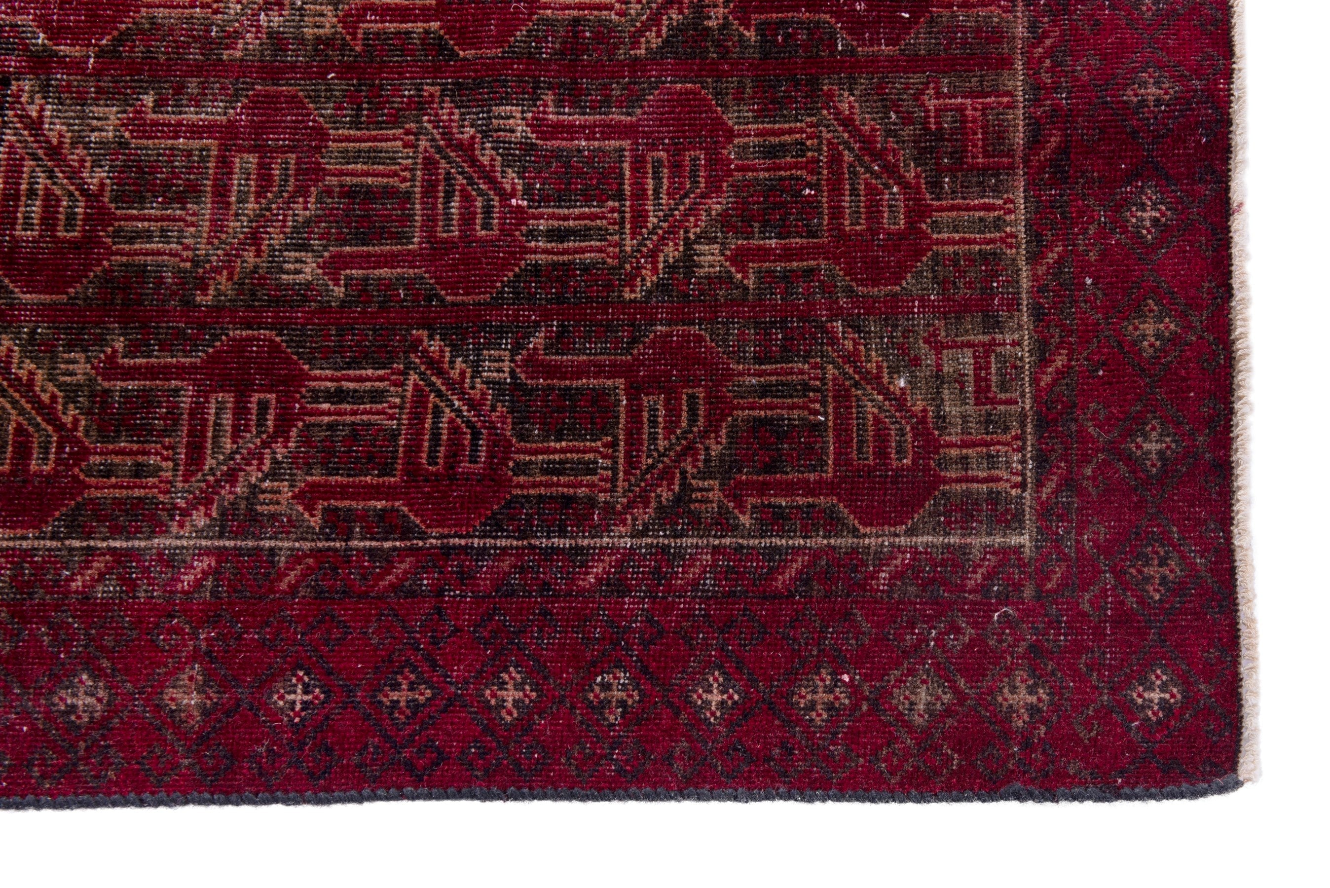 Persian Baluch accent rug in burgundy and faded red, view 5 of 17
