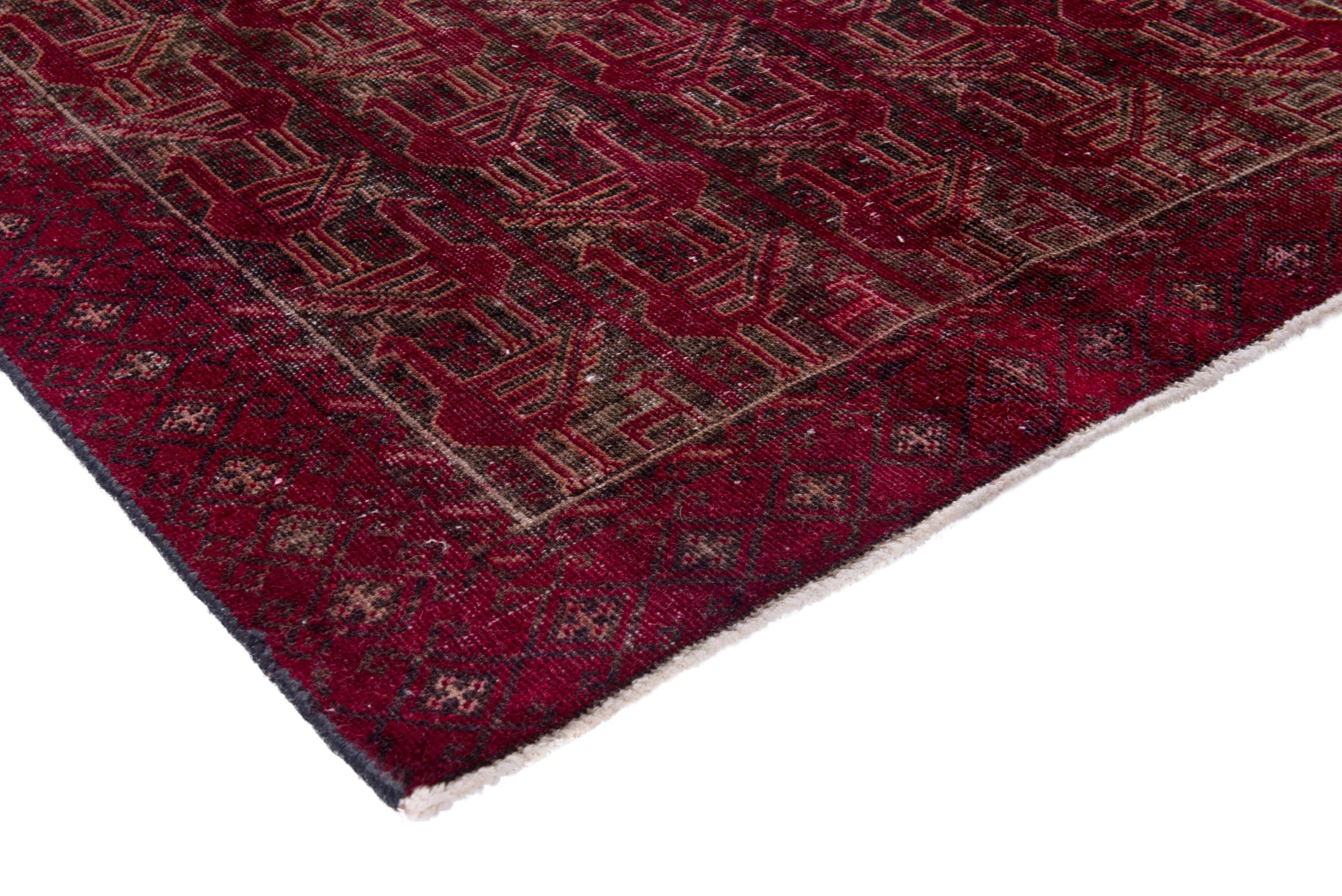 Persian Baluch accent rug in burgundy and faded red, view 4 of 17
