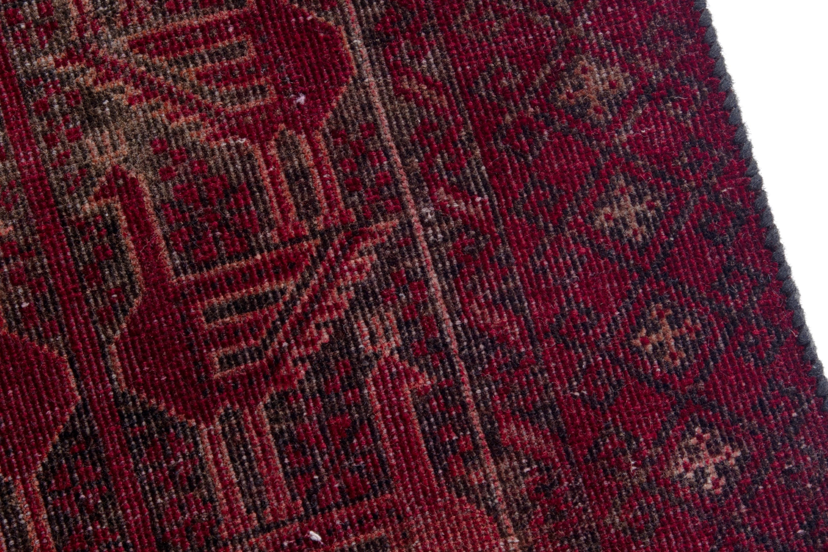 Persian Baluch accent rug in burgundy and faded red, view 7 of 17