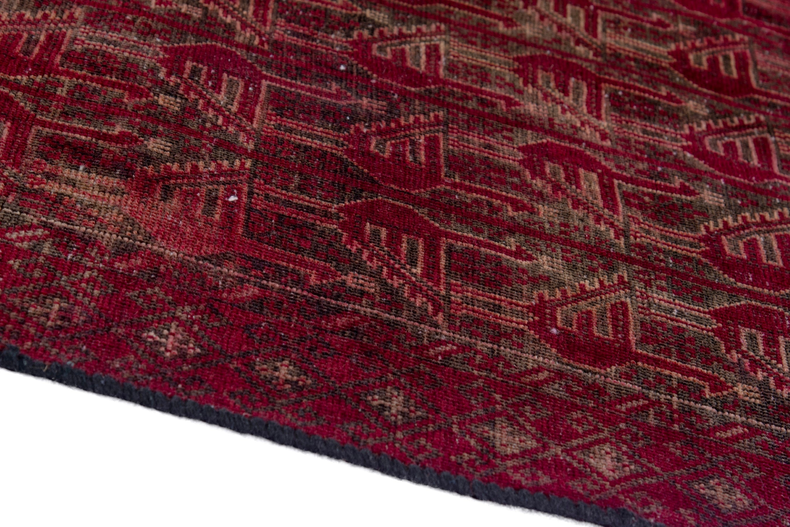 Persian Baluch accent rug in burgundy and faded red, view 8 of 17