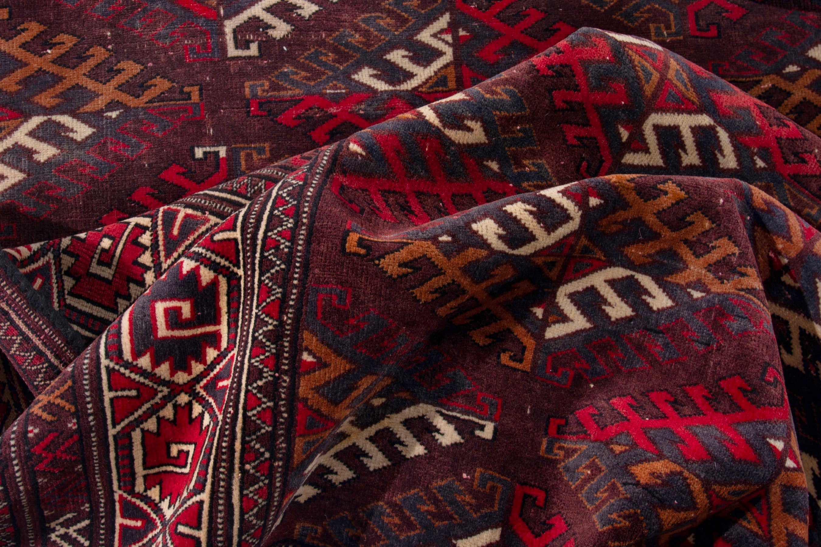 Persian Torkaman oversized rug in burgundy and brick, view 17 of 19