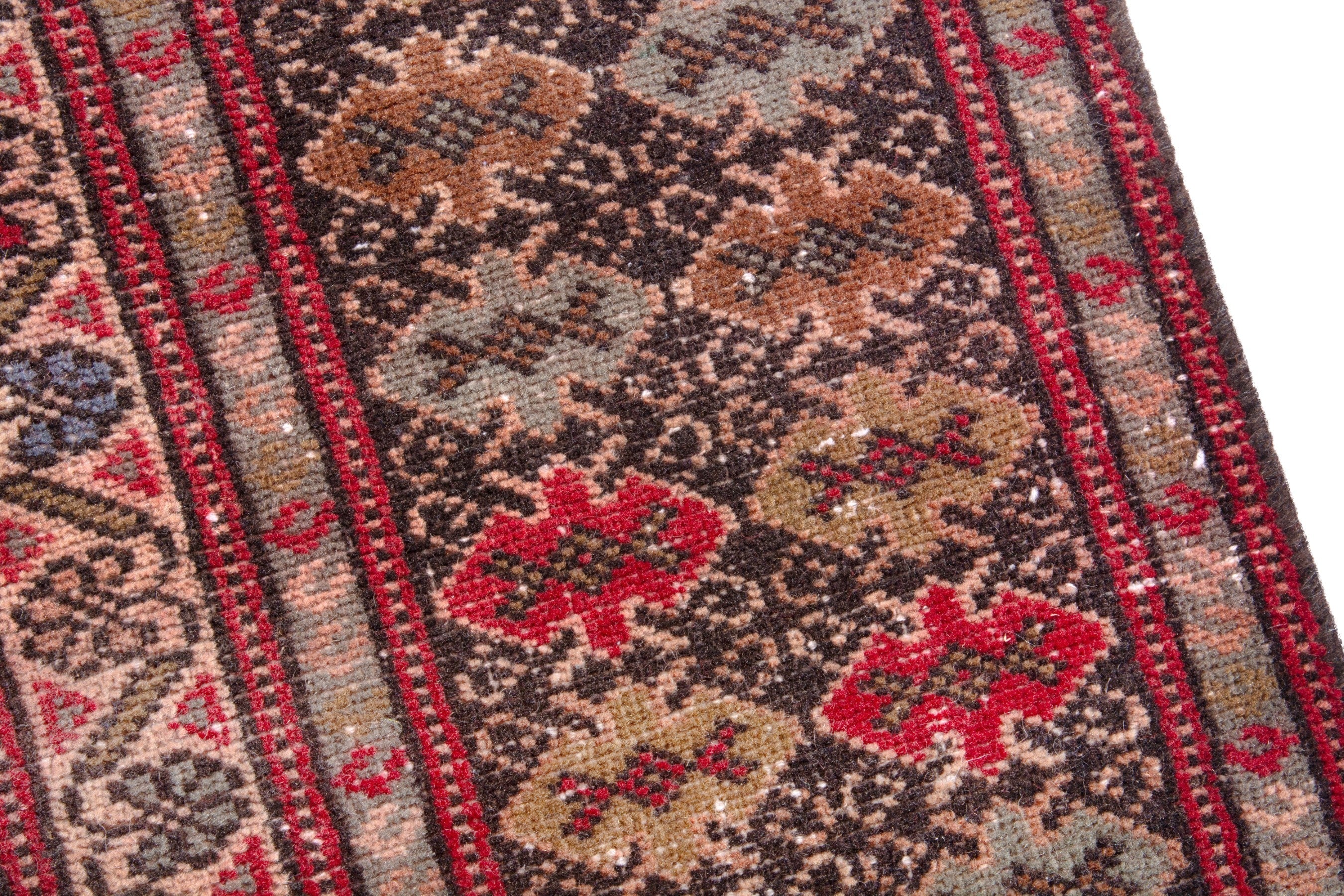 Persian Torkaman oversized rug in deep red and tan, view 7 of 21