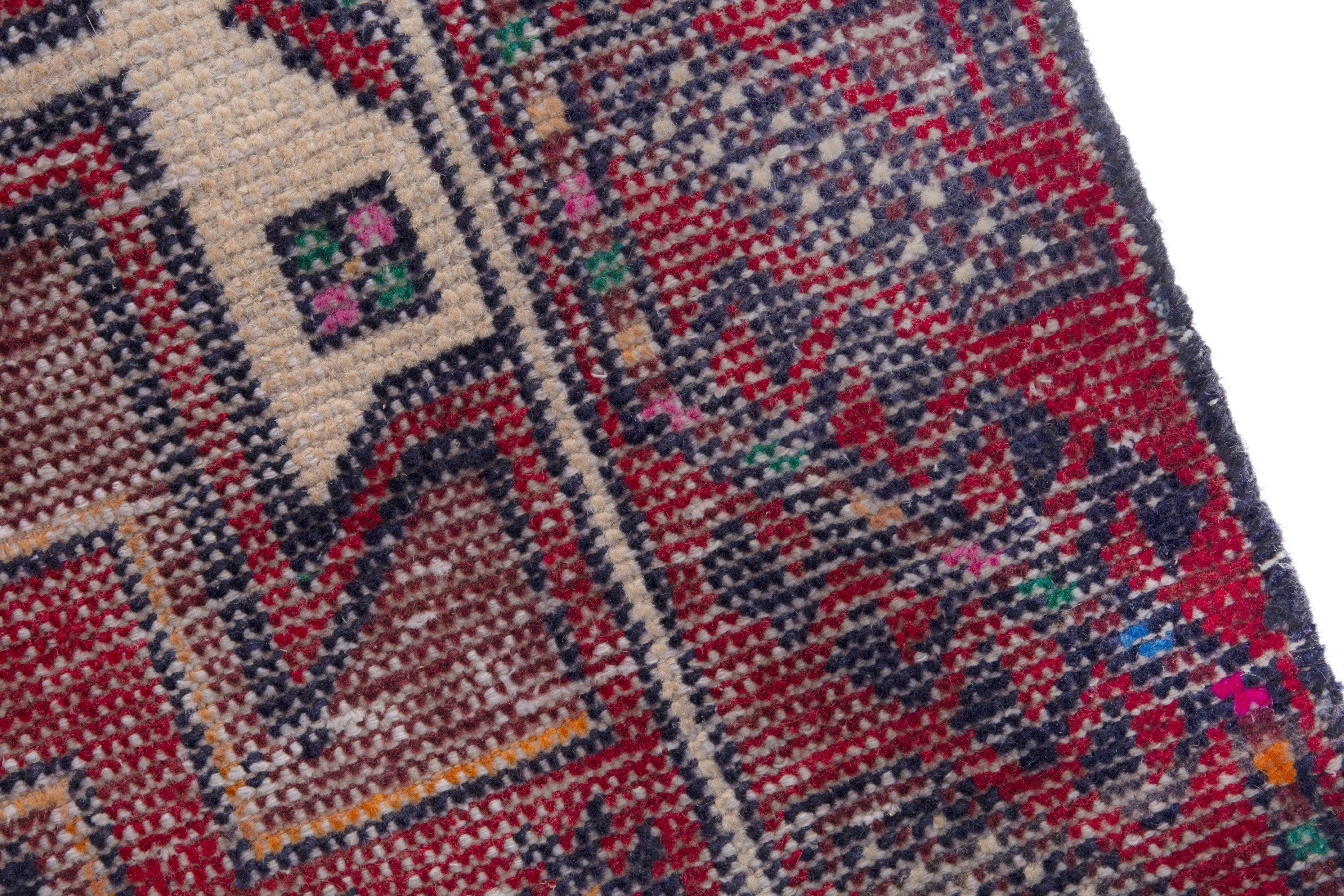 Persian Baluch runner rug in deep red and burgundy, view 7 of 17