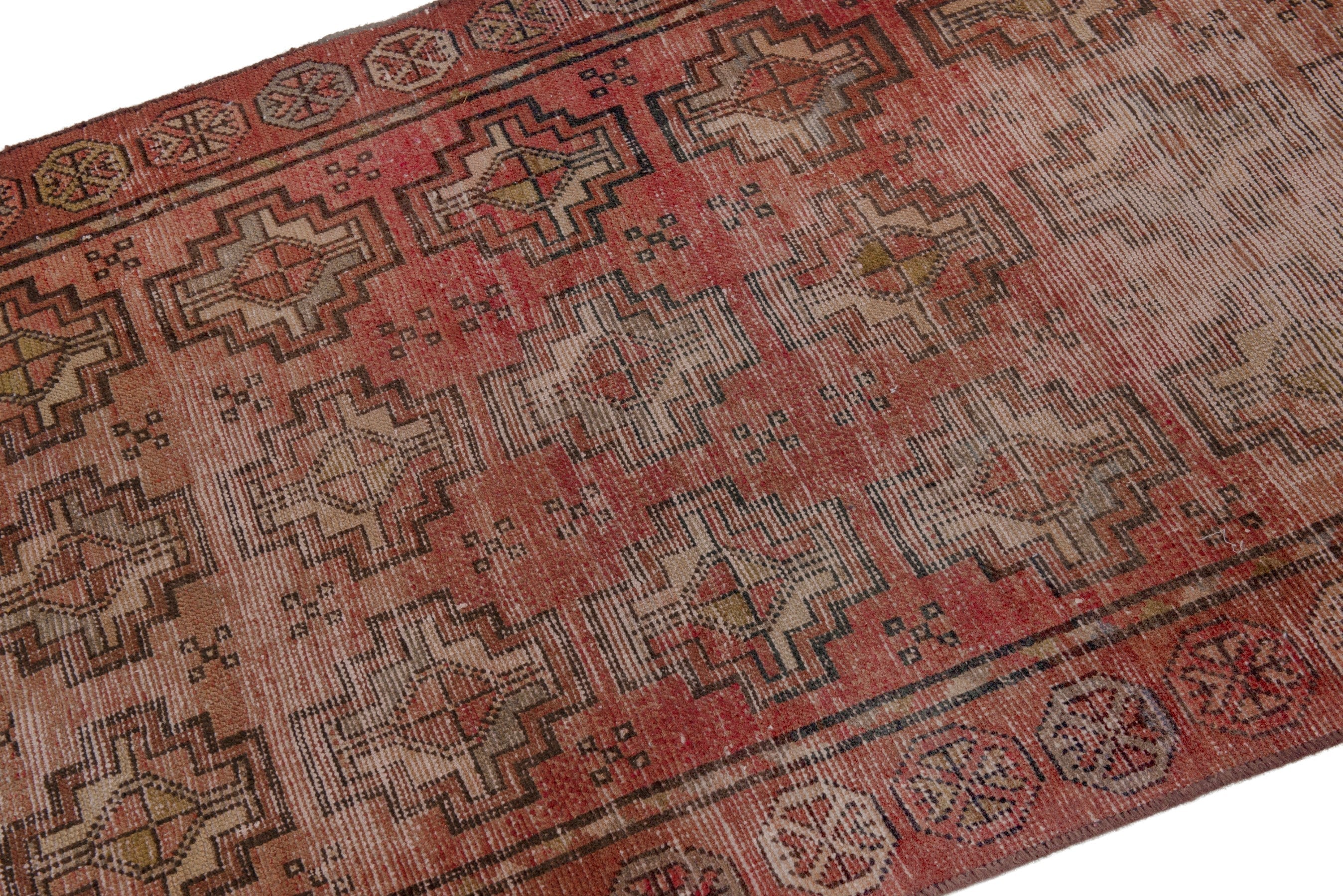 Persian Torkaman runner rug in faded red and muted pink, view 6 of 18