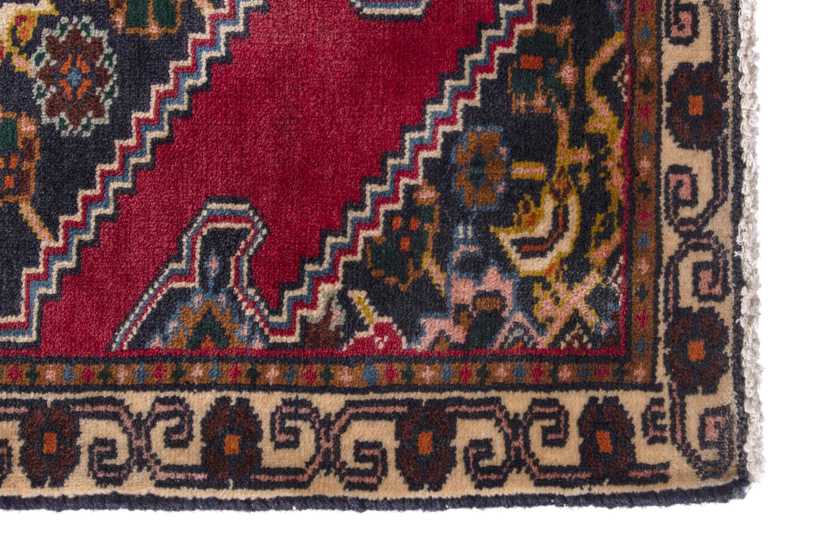 Persian Ghoochan accent rug in deep red and dark blue, view 5 of 7