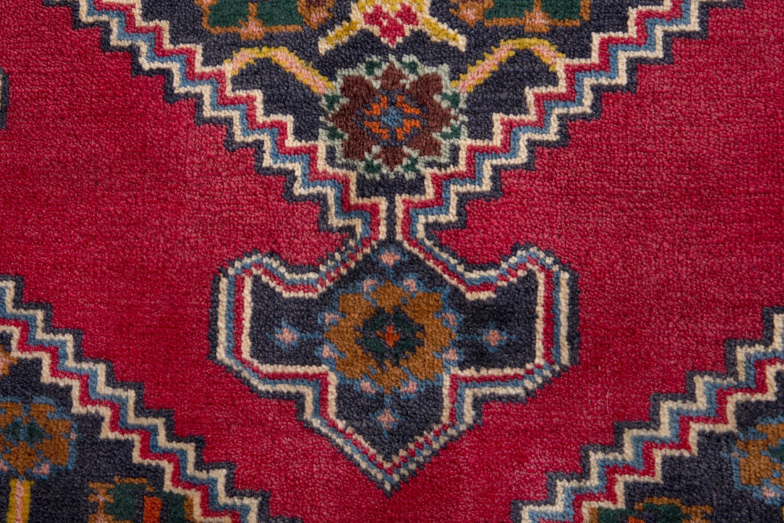 Persian Ghoochan accent rug in deep red and dark blue, view 6 of 7