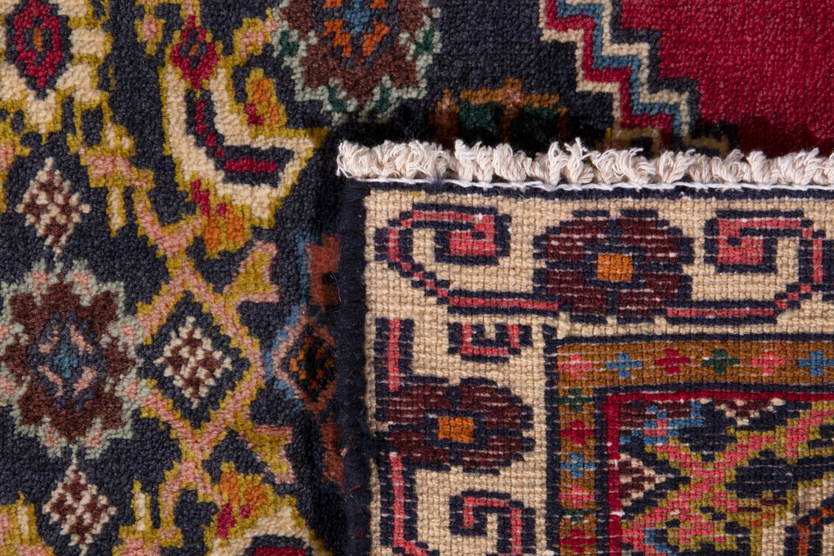 Persian Ghoochan accent rug in deep red and dark blue, view 7 of 7