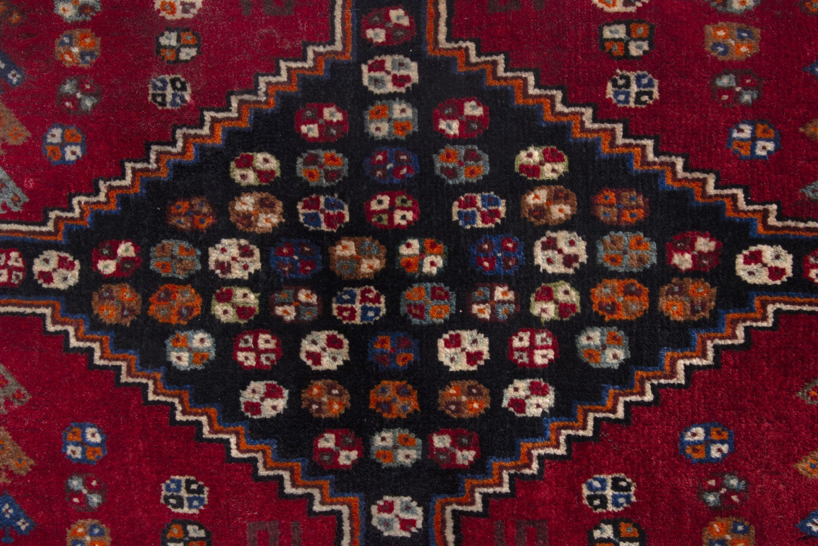 Persian Shiraz accent rug in deep red and dark brown, view 6 of 7