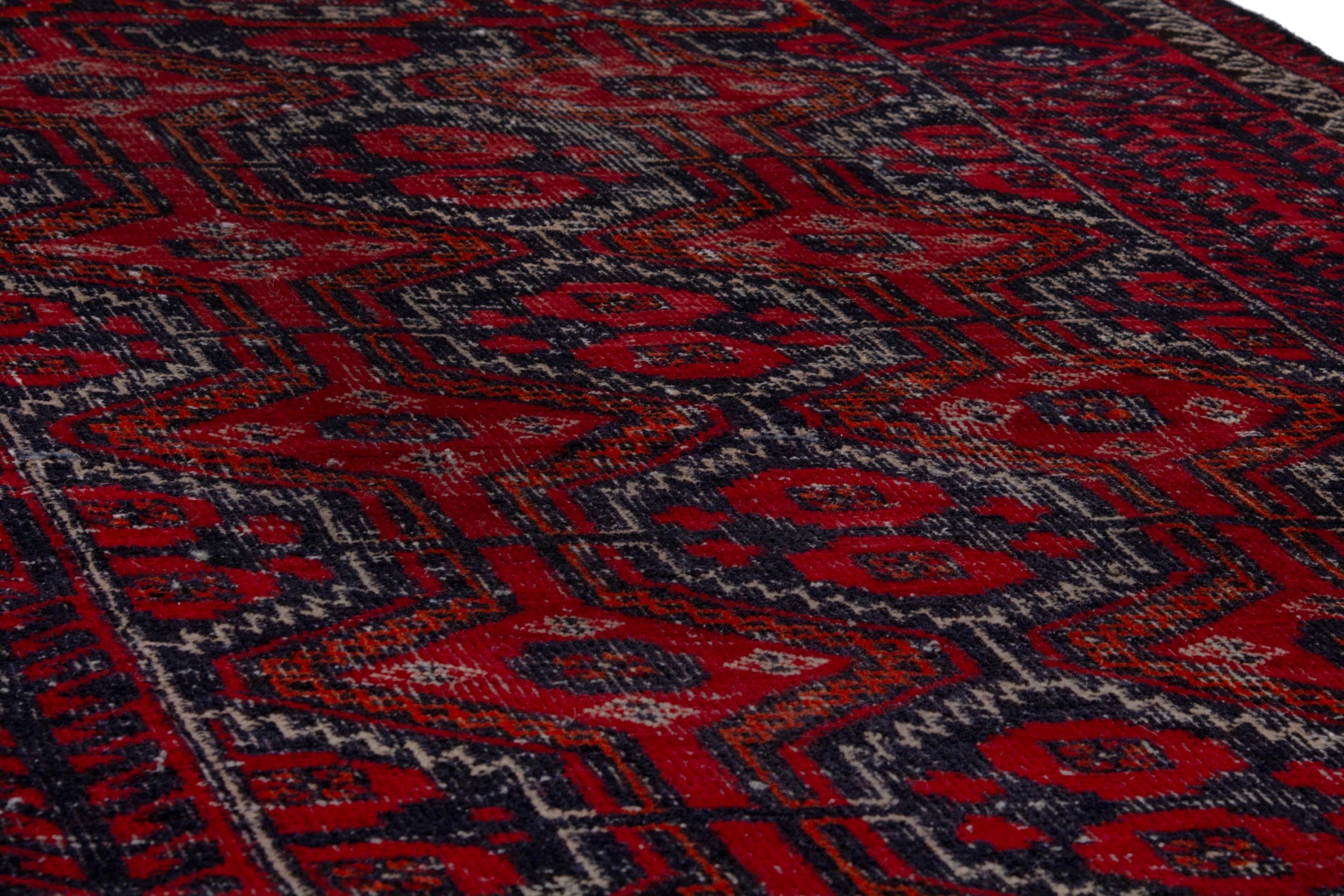 Persian Baluch accent rug in burgundy and faded red, view 10 of 17